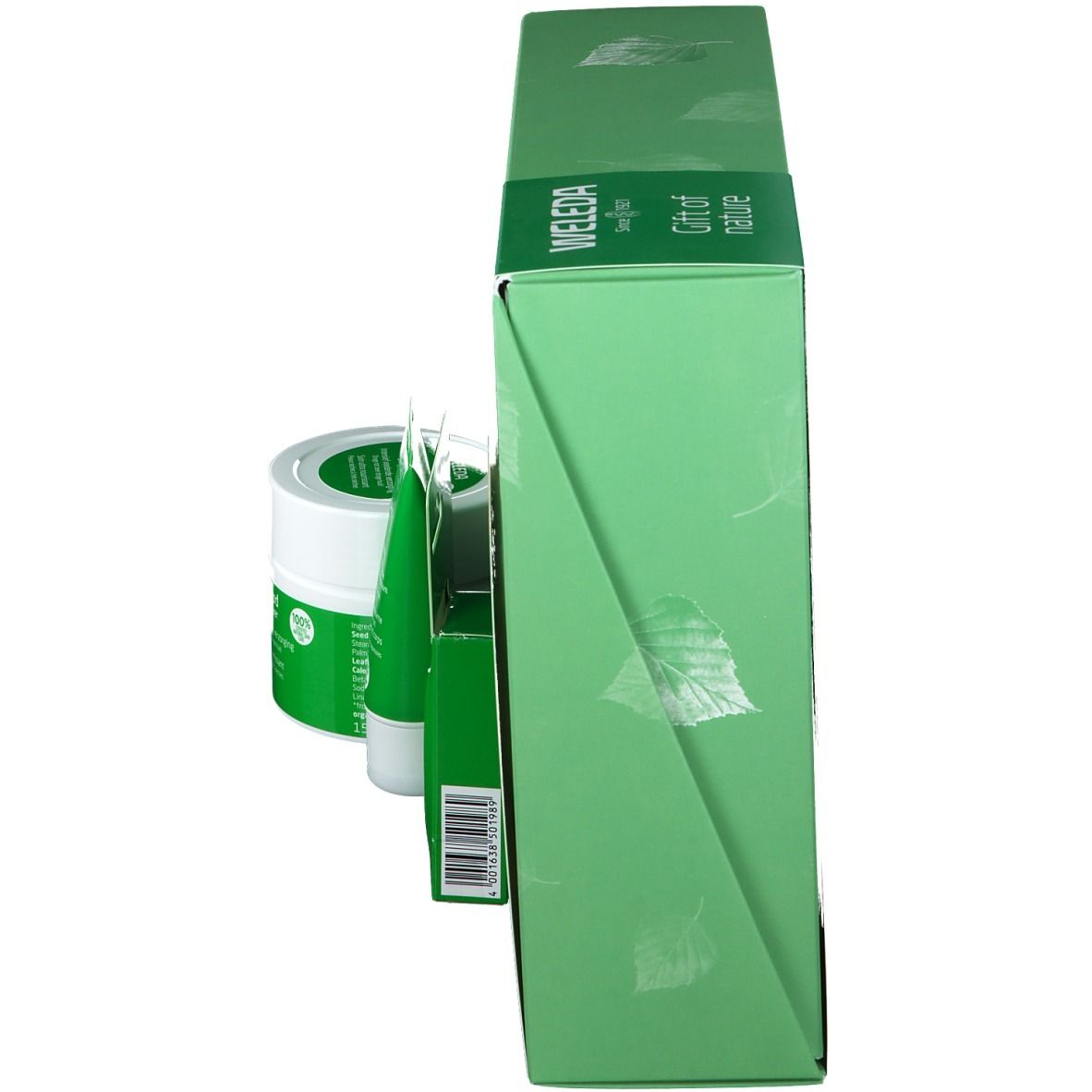 Groene geschenkdoos met producten. Zijaanzicht. Weleda-logo en bladerenpatroon op de verpakking.