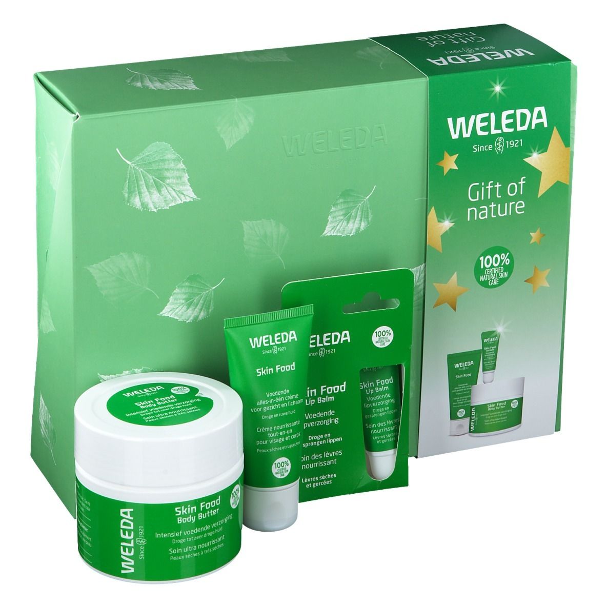 Cadeauset met lotion, crème en lippenbalsem. Groene verpakking. Weleda-logo.