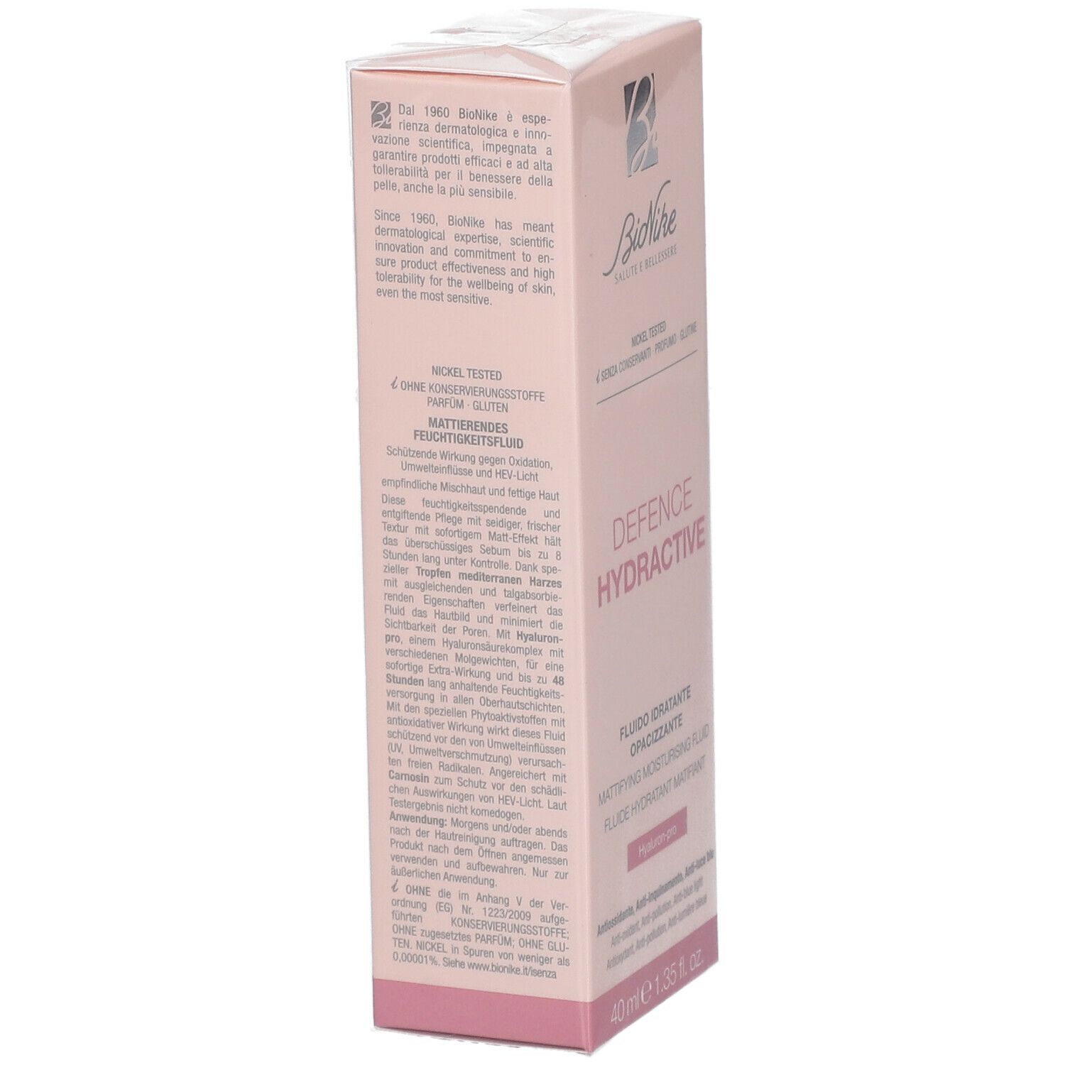 Roze verpakking, productnaam en merk zichtbaar. Tekst: DEFENCE HYDRACTIVE, FLUIDO IDRATANTE OPACIZZANTE, 40 ml. Detailweergave.