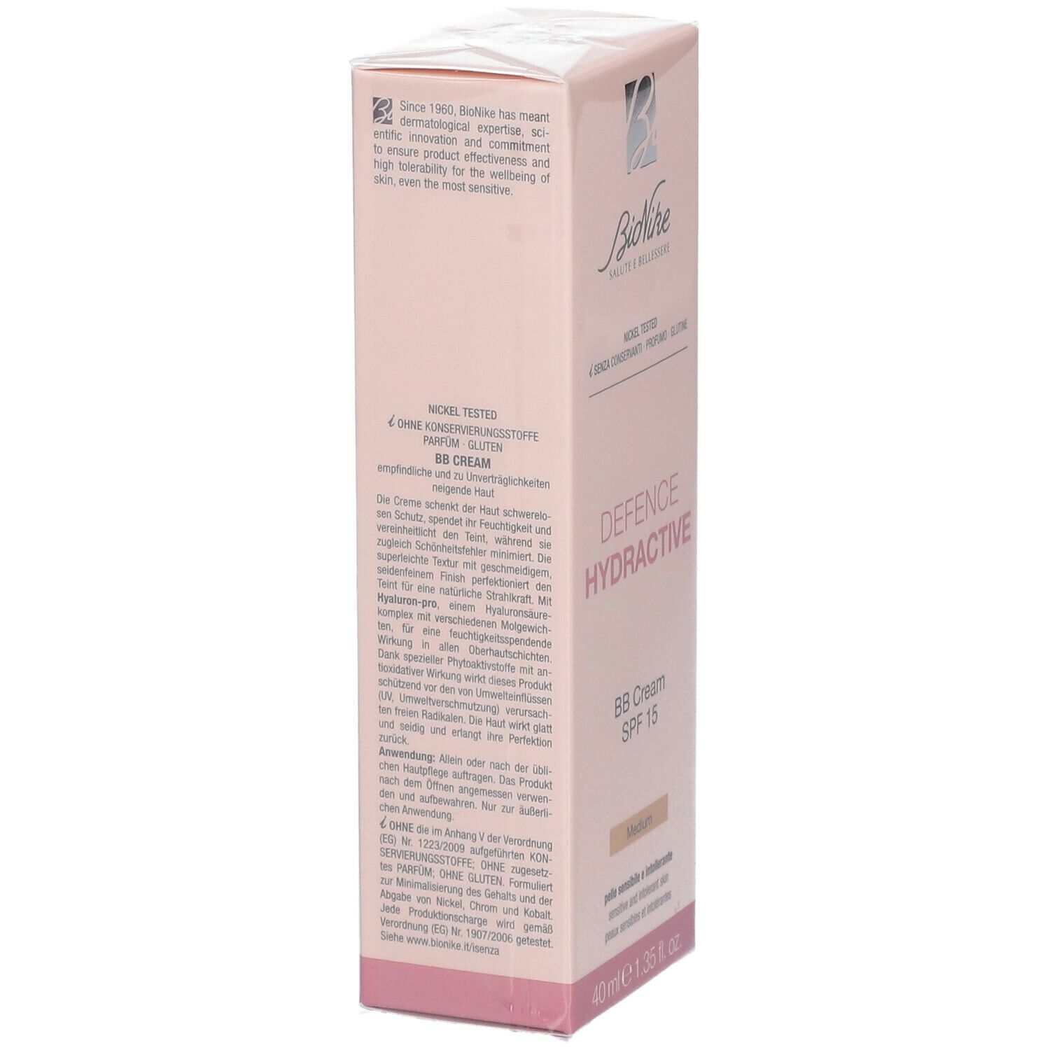 Roze verpakking van BioNike DEFENCE HYDRACTIVE BB Crème SPF15 Medium. Tekst op de zijkant. Nickel Tested, zonder conserveermiddelen, parfum, gluten.