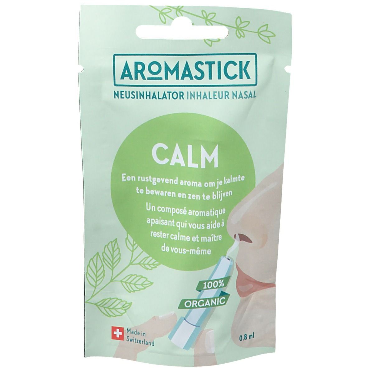Verpakking met Aromastick Calm. Groen en wit, met productnaam en tekst. Neus met inhalator.