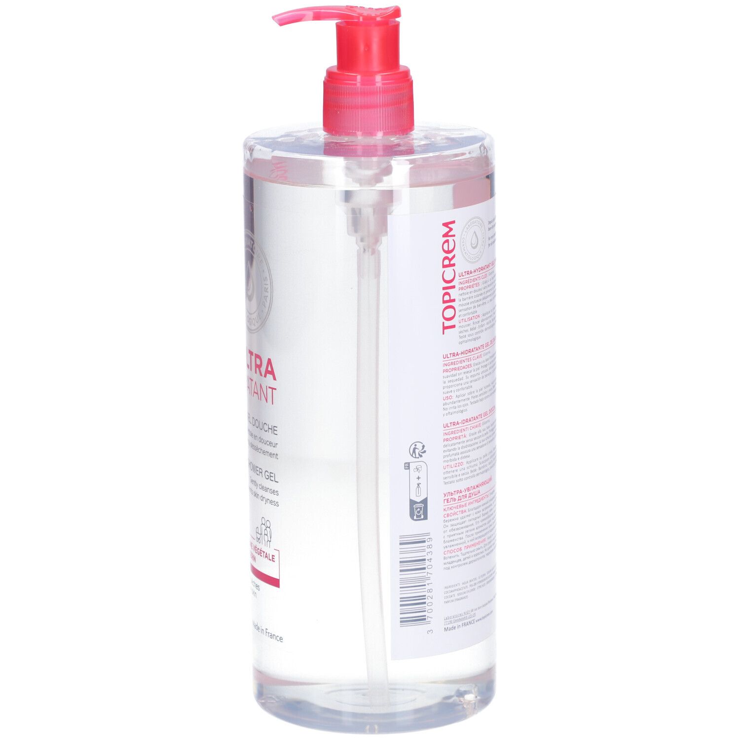 Rückansicht der transparenten Flasche TOPICREM Duschgel mit rosa Etikett und Dosierpumpe. Text auf dem Etikett.