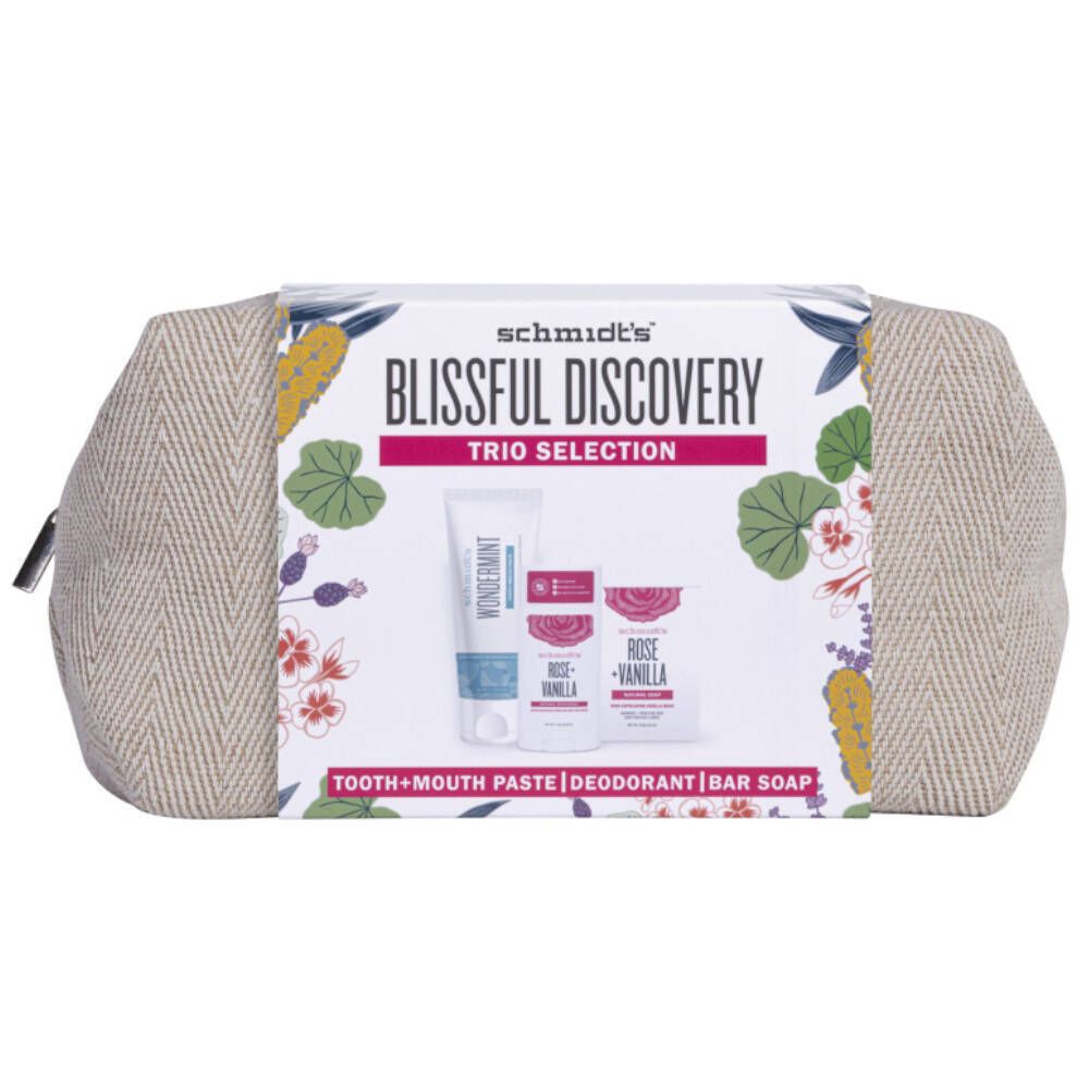 Geschenkset met tandpasta, deodorant en zeep. Verpakt in een beige toilettas met rits. Opschrift: Blissful Discovery.