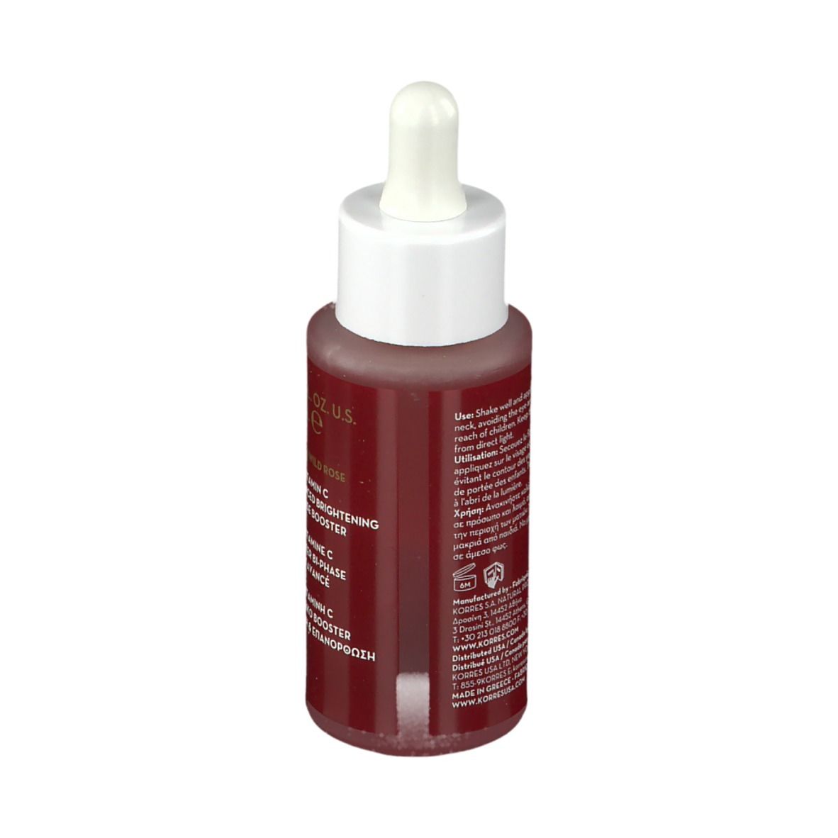 Achterkant KORRES Wild Rose fles. Tekst over gebruik en ingrediënten. Glazen fles. Meertalige informatie.