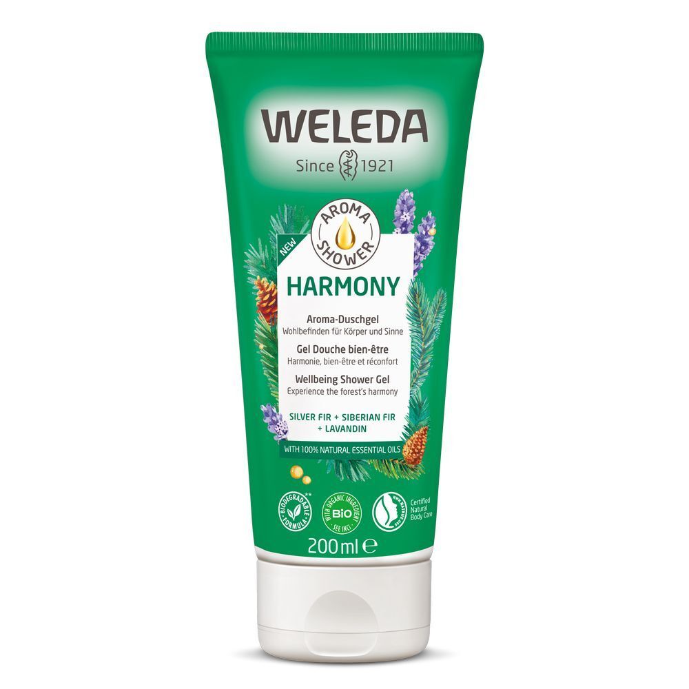 Groene tube met witte dop. Opschrift: WELEDA, Aroma Shower Harmony, Wellbeing Shower Gel. Met bio-keurmerk en 100% natuurlijke etherische oliën.