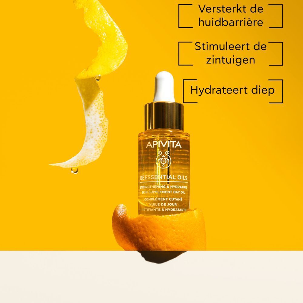 Productfles met gouden dop en pipet. Gele achtergrond.