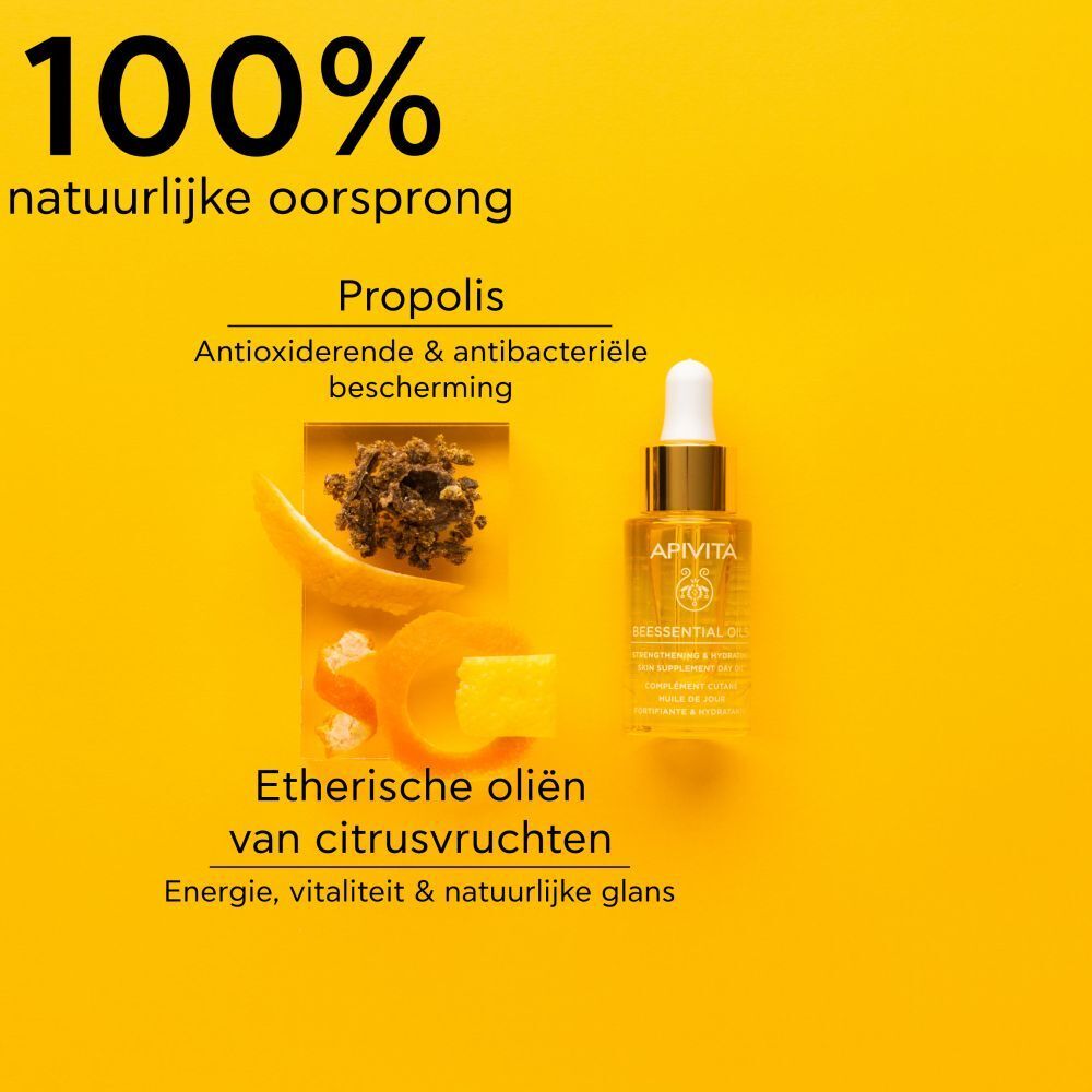 Productfles met gouden dop en pipet. Gele achtergrond.