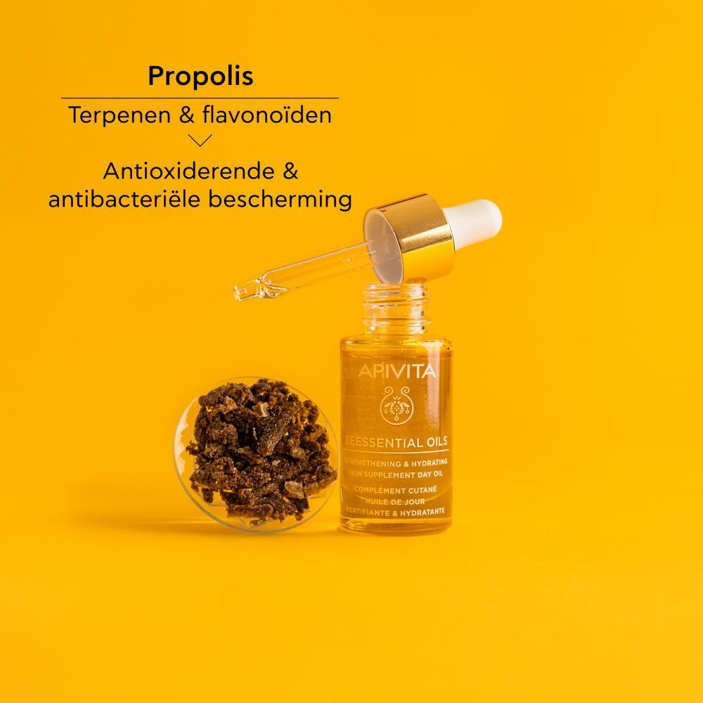 Productfles met gouden dop en pipet. Gele achtergrond.