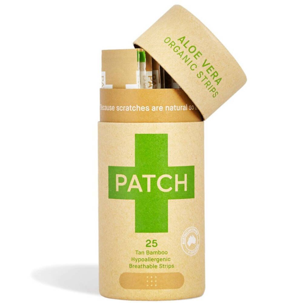 Emballage cylindrique en carton avec "PATCH" et croix verte. Contient des pansements. Inscription : Aloe Vera Organic Strips.