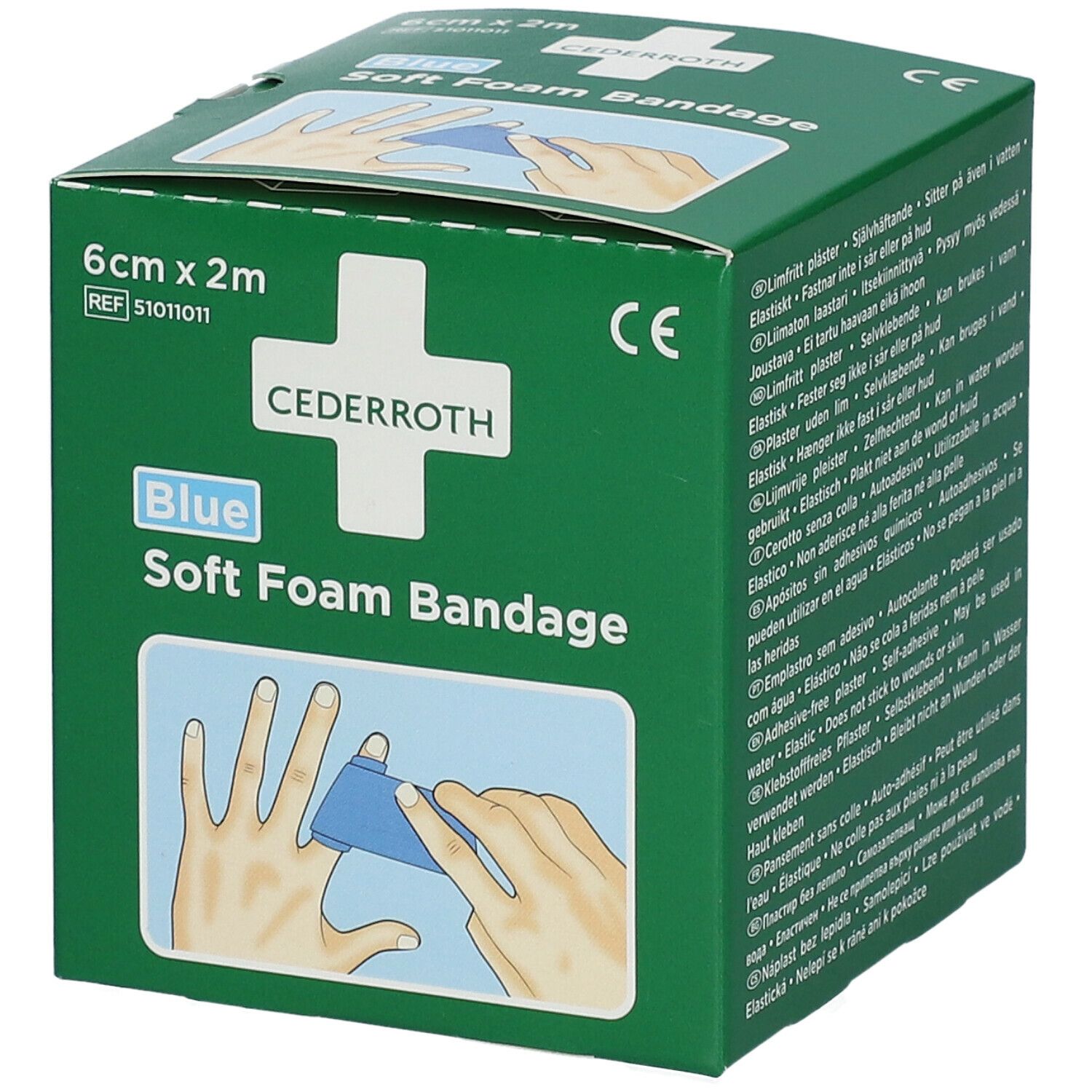 Groene verpakking Cederroth Soft Foam Bandage. Blauwe tekst, 6 cm x 2 m. CE-markering. Illustratie van een hand met een pleister.