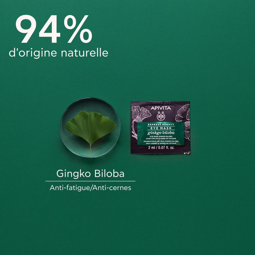 Masque pour les yeux et feuille de ginkgo sur fond vert. Texte : 94% d'origine naturelle. Ginkgo Biloba.