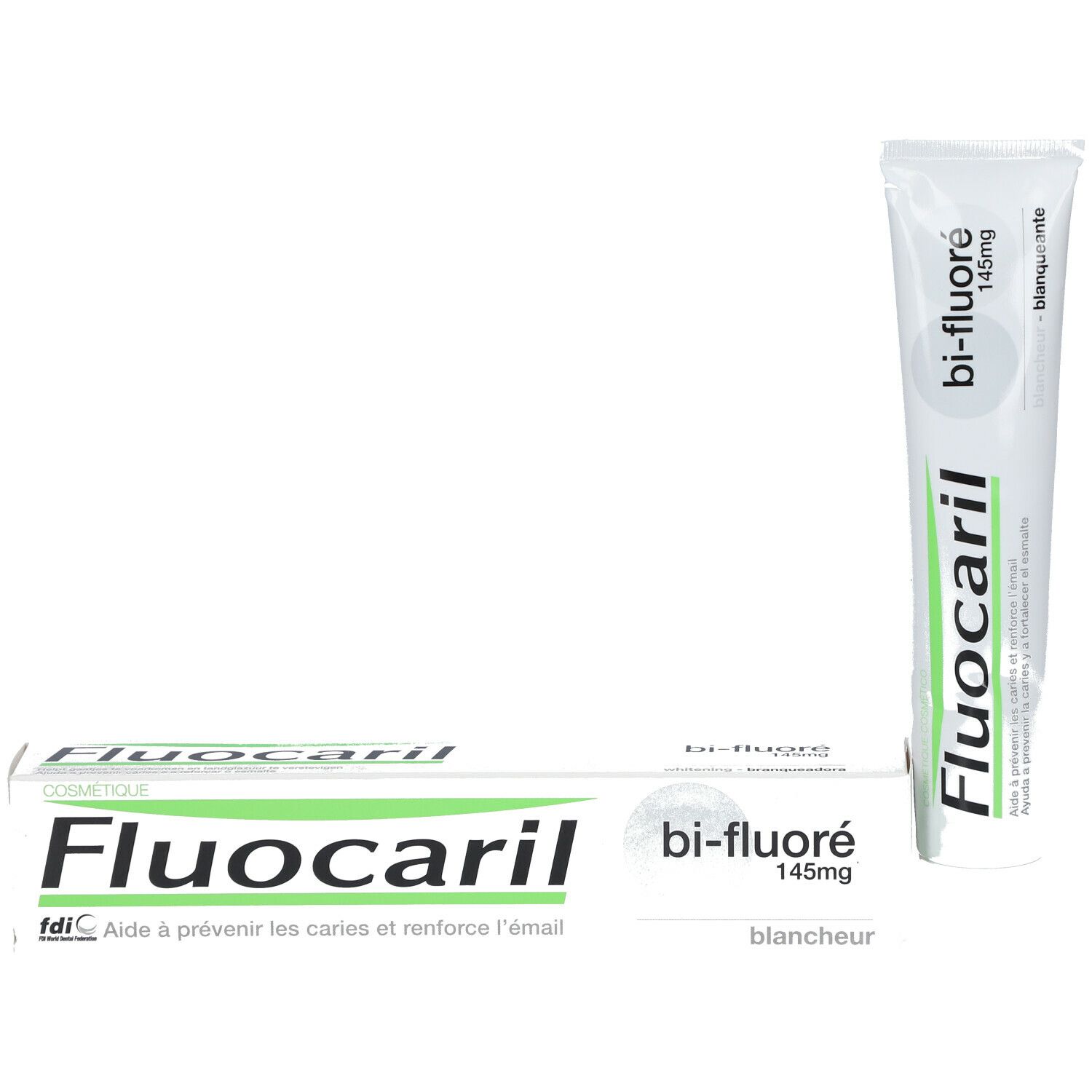 Zahnpasta-Tube und Schachtel. Aufschrift: Fluocaril, Bi-Fluoré 145mg. Weißer Hintergrund.