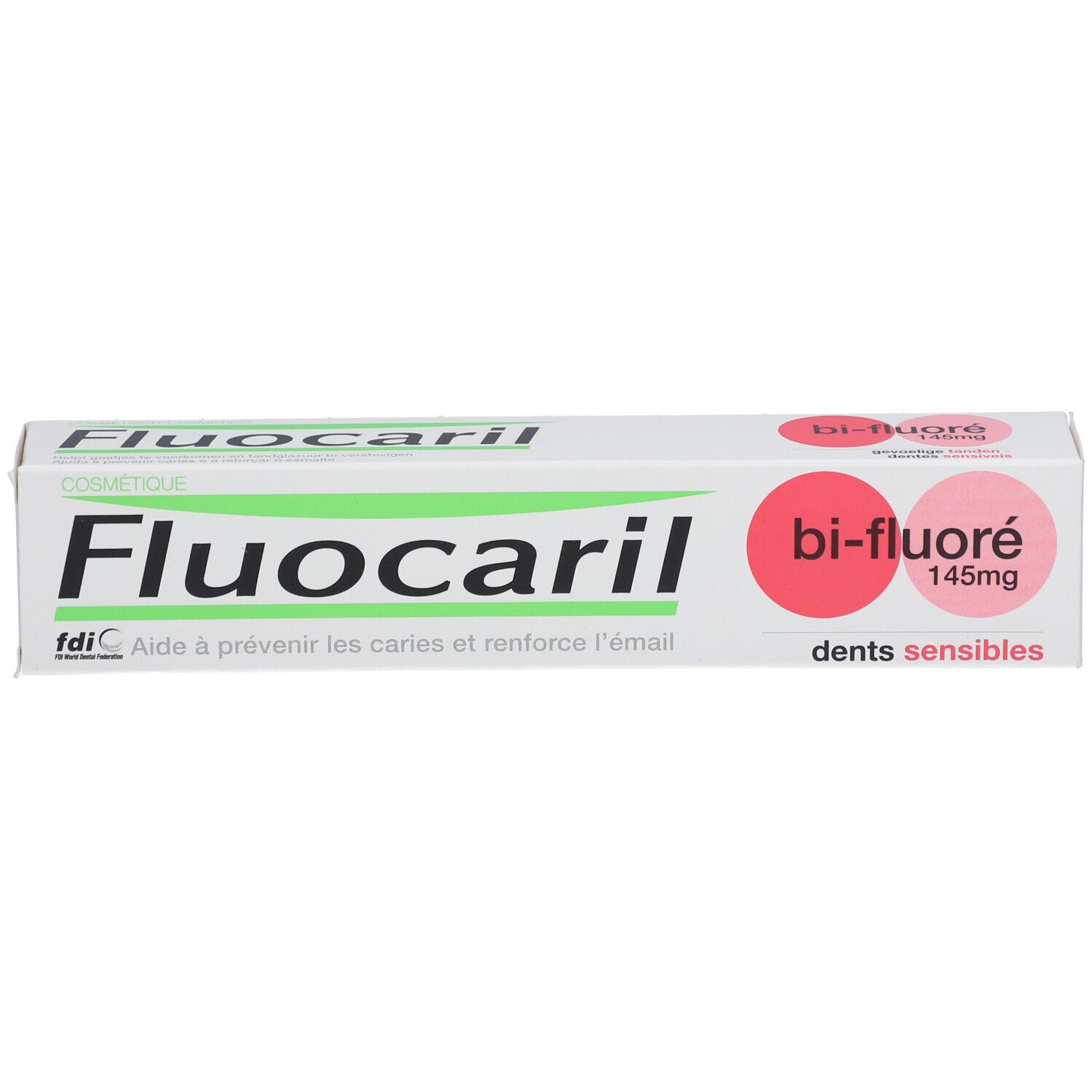 Tandpastadoos. Opschrift: Fluocaril, Bi-Fluoré 145mg, Dents sensibles. Witte doos met roze accenten.
