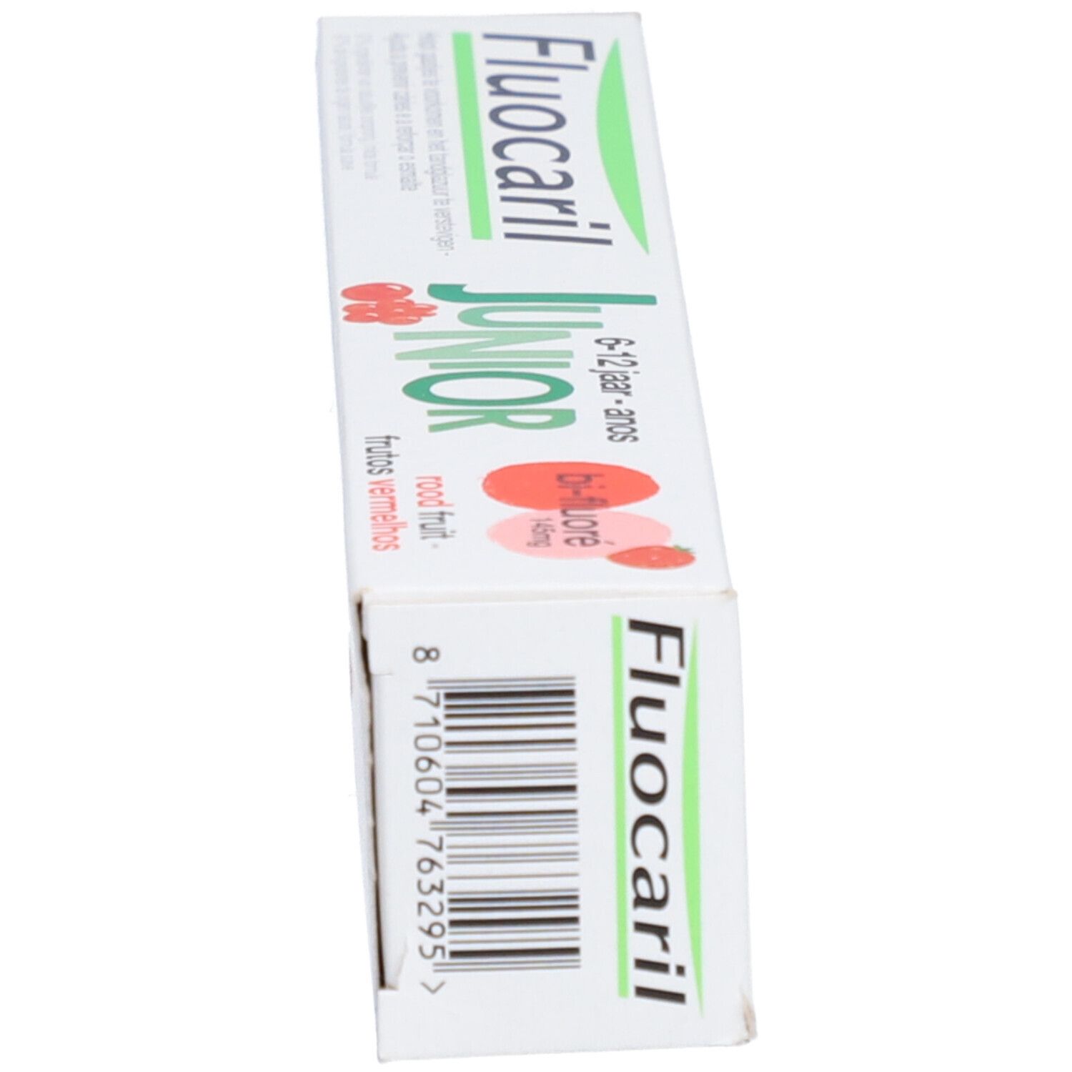 Tandpastaverpakking. Fluocaril Junior, 6-12 jaar. Bi-fluoré. Rode vruchten. Doos, schuin aanzicht.