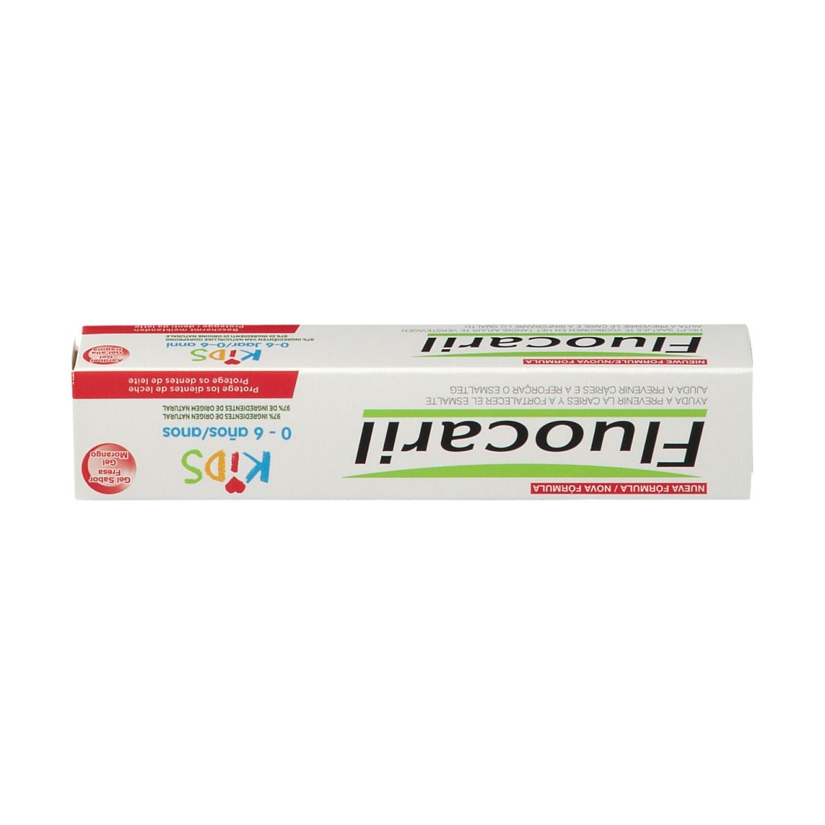 Boîte de dentifrice pour enfants. Blanc, avec texte rouge et vert. Inscription : Fluocaril Kids 0-6 ans.