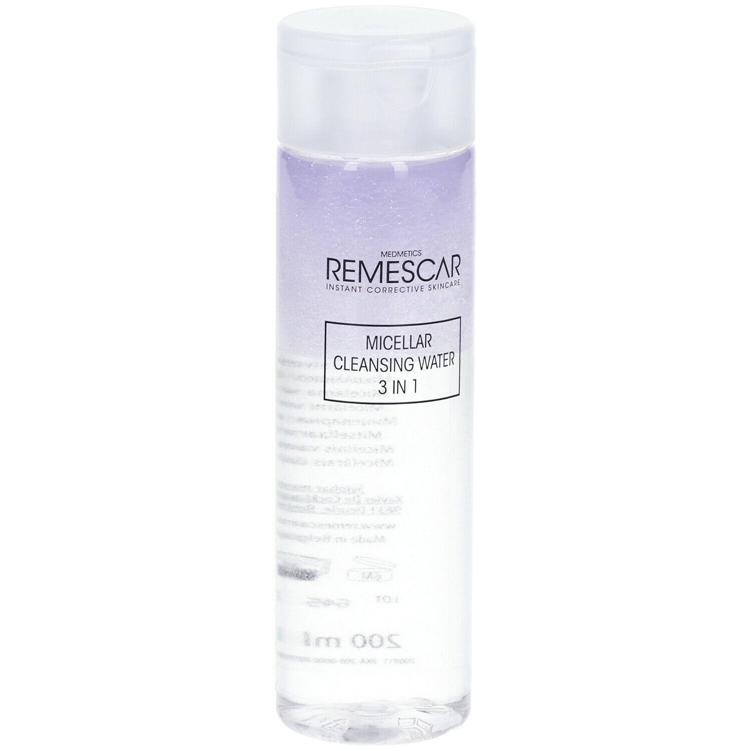 Transparante fles met witte dop. Label met productnaam en merk. Vloeistof met paarse tint.