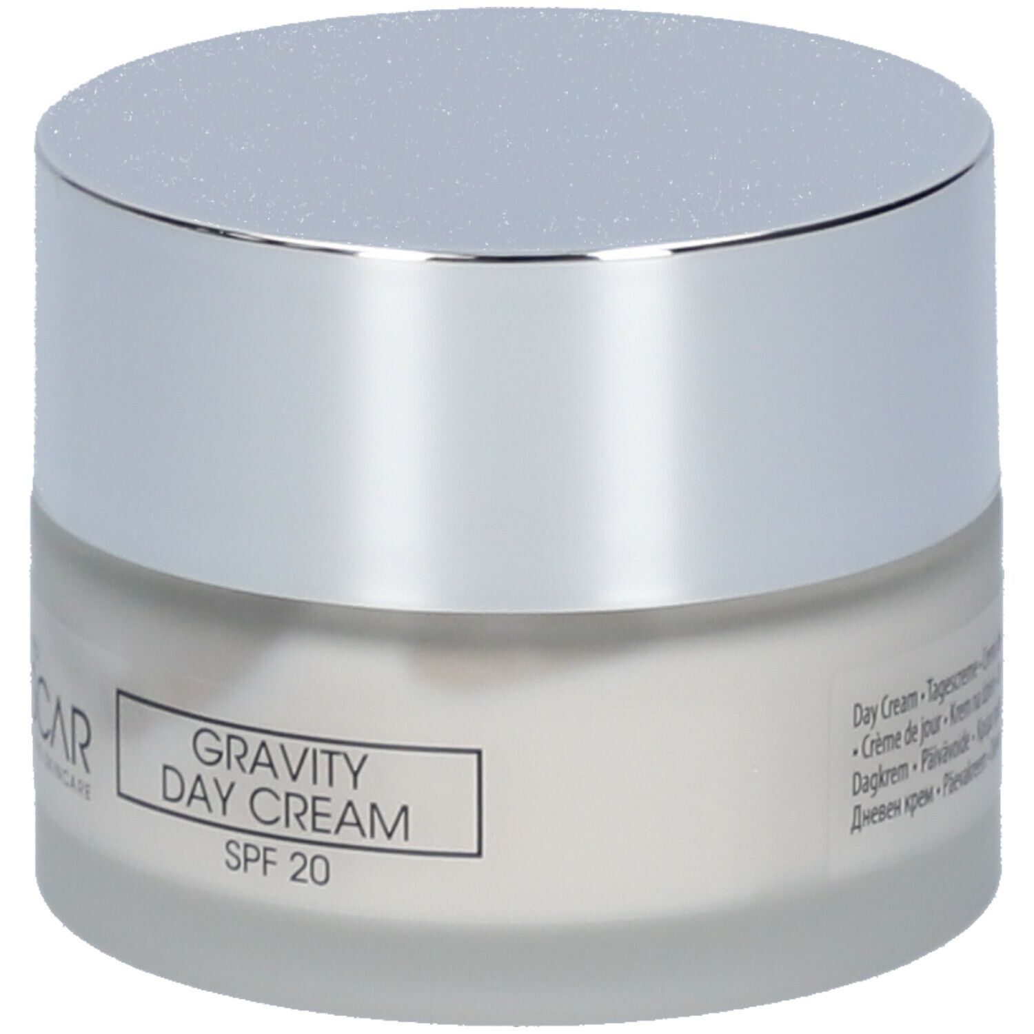 Crèmepot met zilveren deksel. Etiket met "Gravity Day Cream SPF 20".