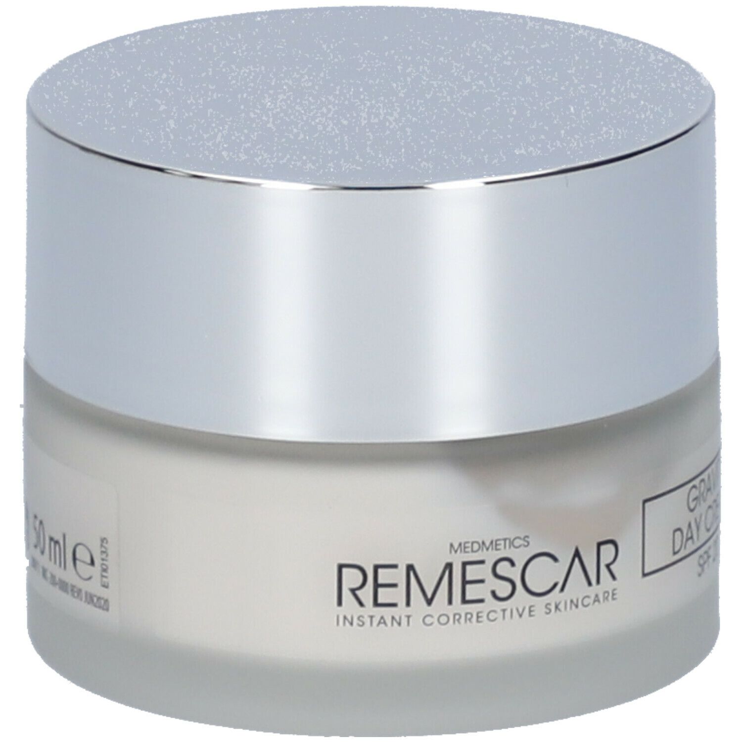Crèmepot met zilveren deksel. Etiket met "Remescar Gravity Day Cream SPF 20".