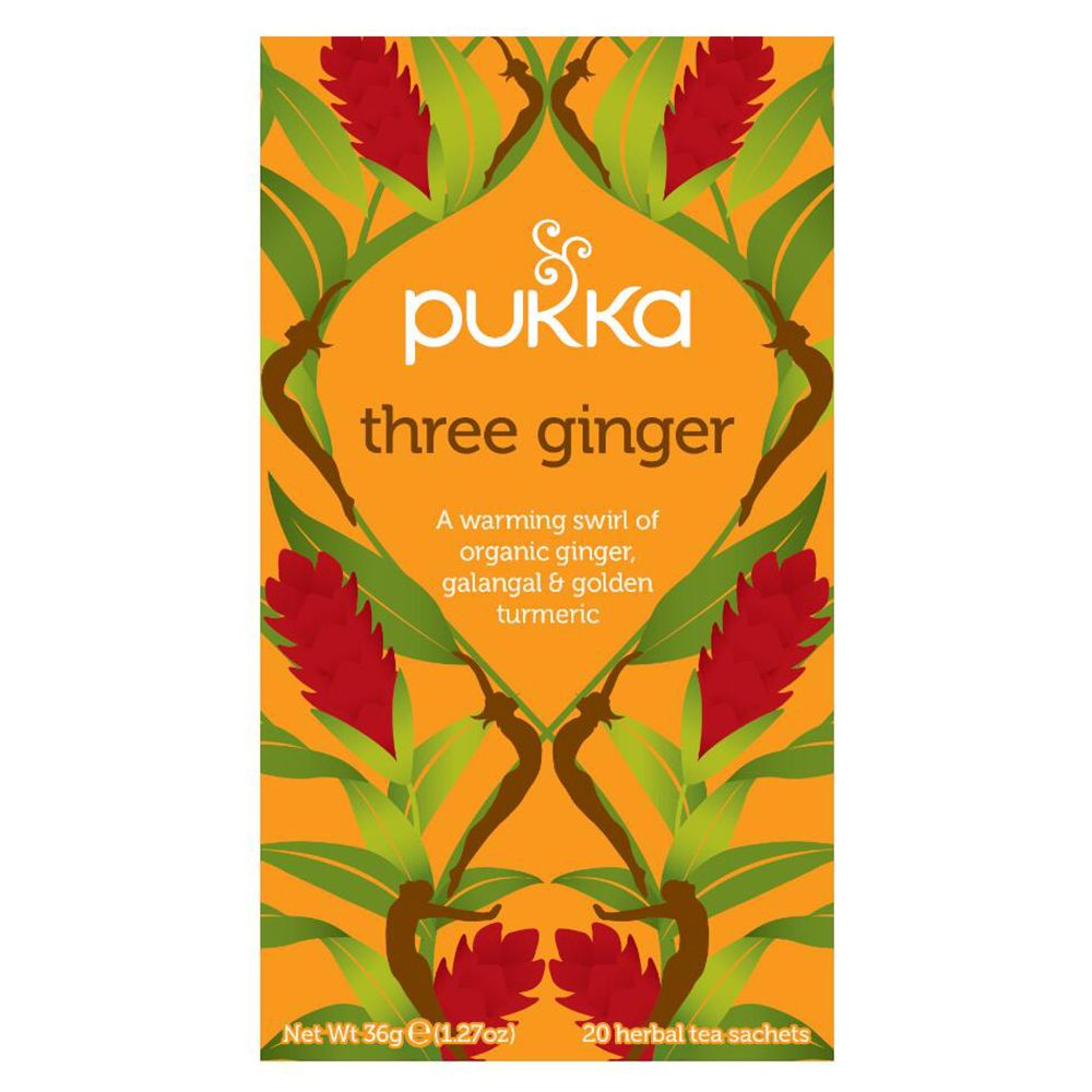 Thé Pukka Three Ginger. Emballage orange avec motif floral. Nom du produit et ingrédients visibles.