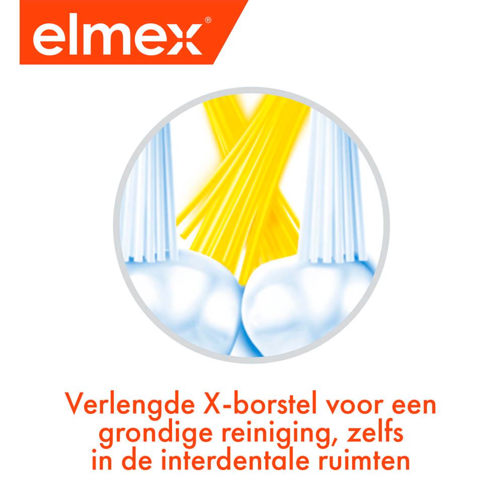 Close-up van de borstelharen. Opschrift: elmex. Tekst: Verlengde X-borstel voor een grondige reiniging, zelfs in de interdentale ruimten.