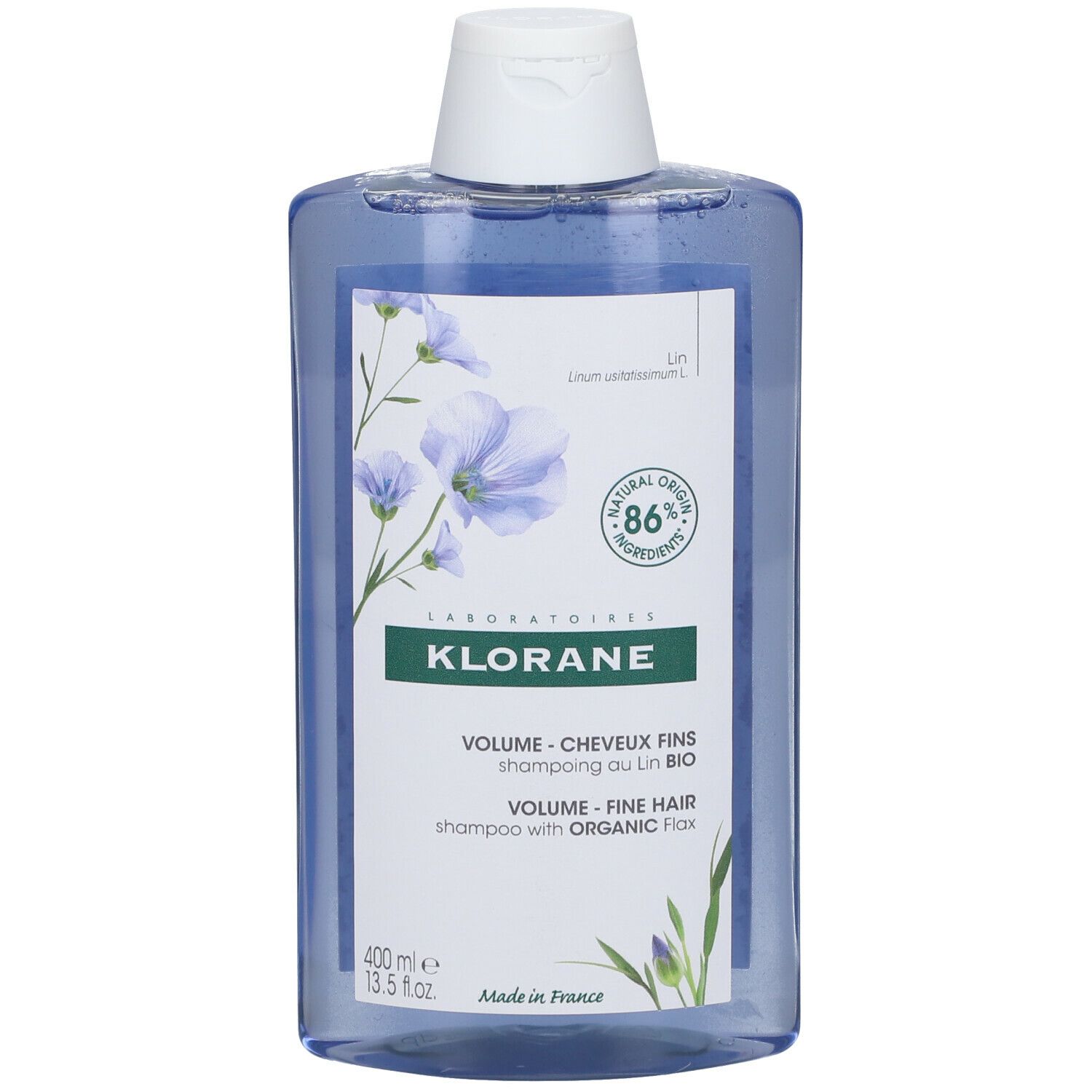 Klorane Volume Shampoo Vlas. Blauwe fles met witte dop. Etiket met productinfo en vlas-illustratie.
