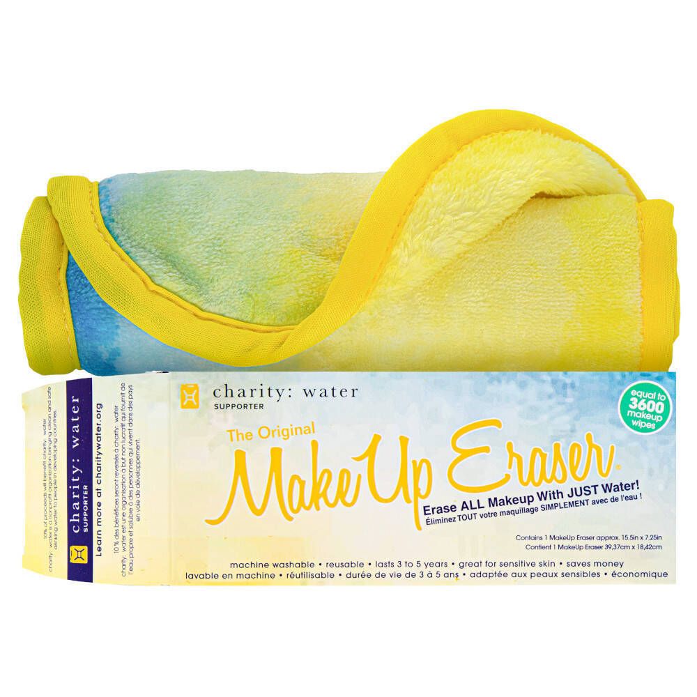 Tissu jaune et bleu plié, bord jaune. En dessous, emballage rectangulaire avec nom du produit et texte.