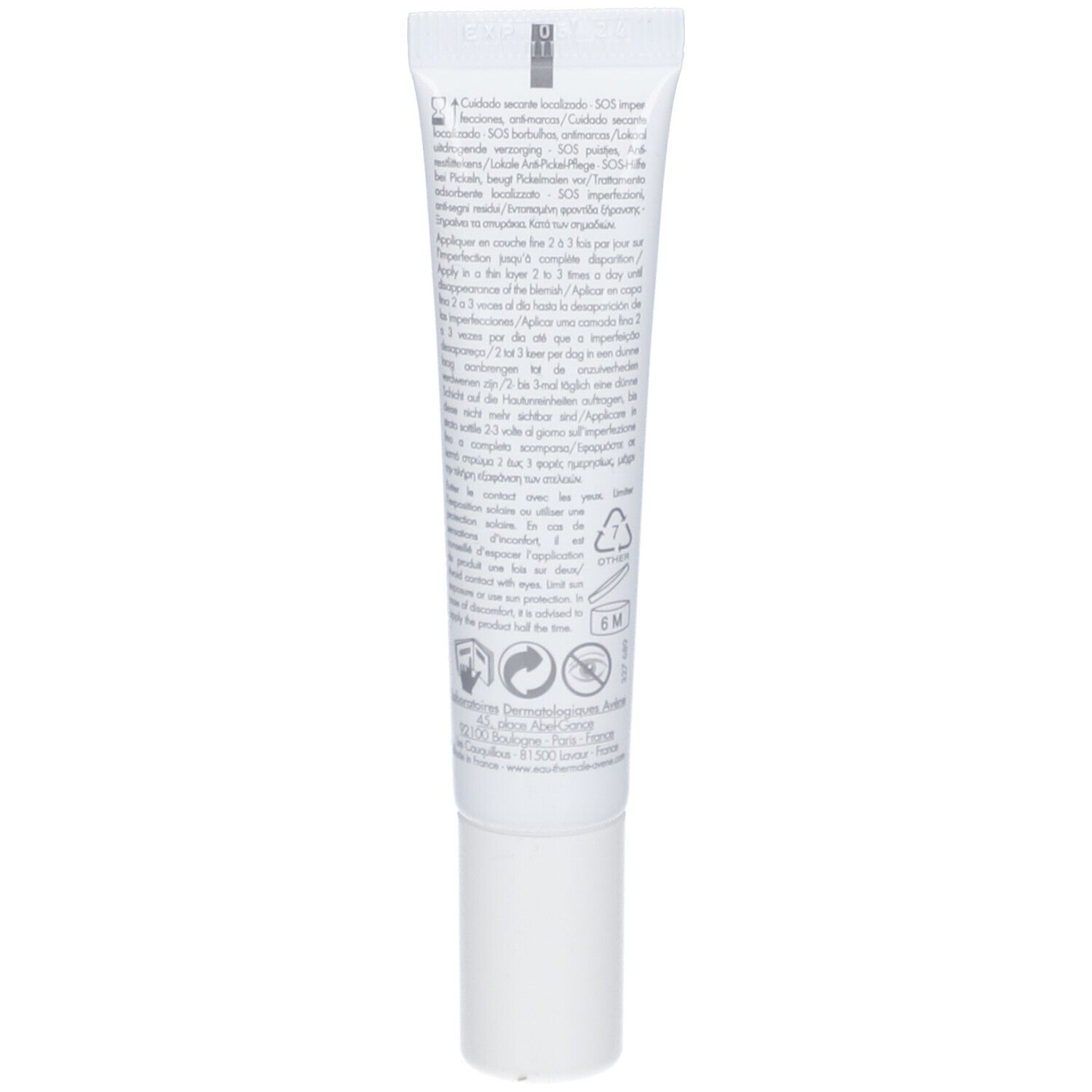 Dos d'un tube blanc. Texte multilingue. Informations sur l'utilisation et les ingrédients.