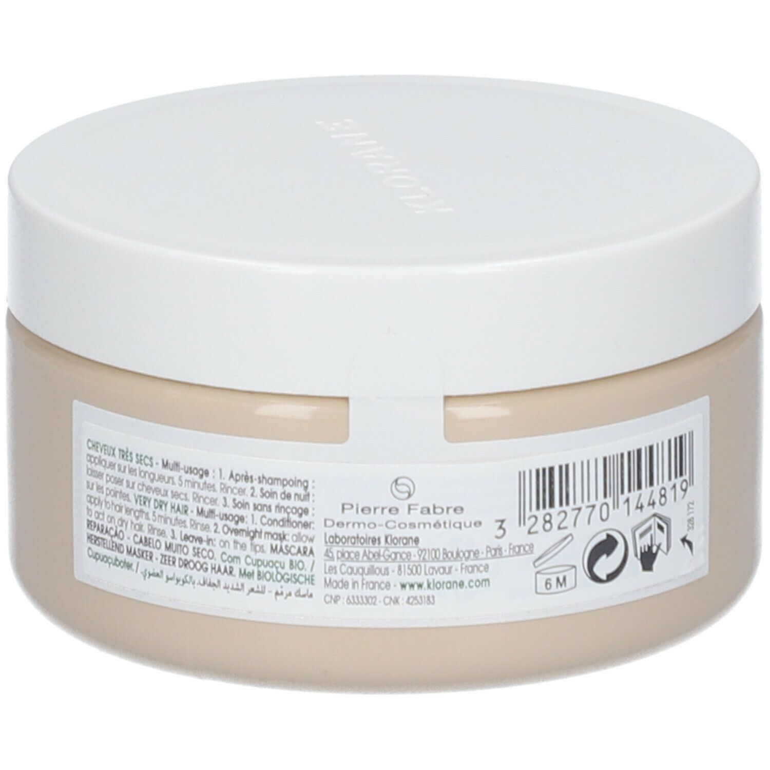 Beige pot met witte deksel. Achterkant met tekst in meerdere talen. Fabrikantinformatie en logo's.