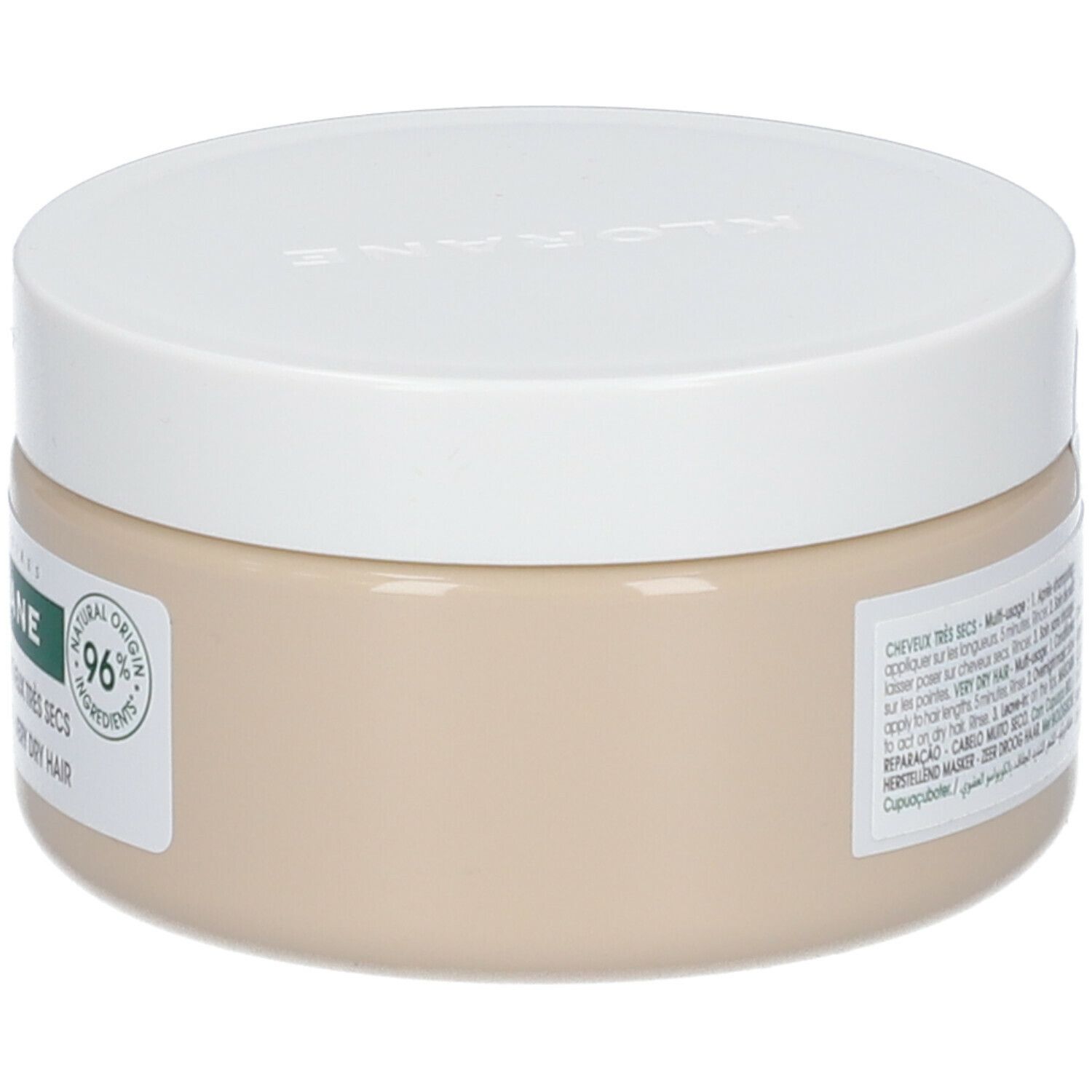 Beige pot met witte deksel. Etiket met productnaam KLORANE en 96% Natural Origin. Tekst: Cheveux très secs.