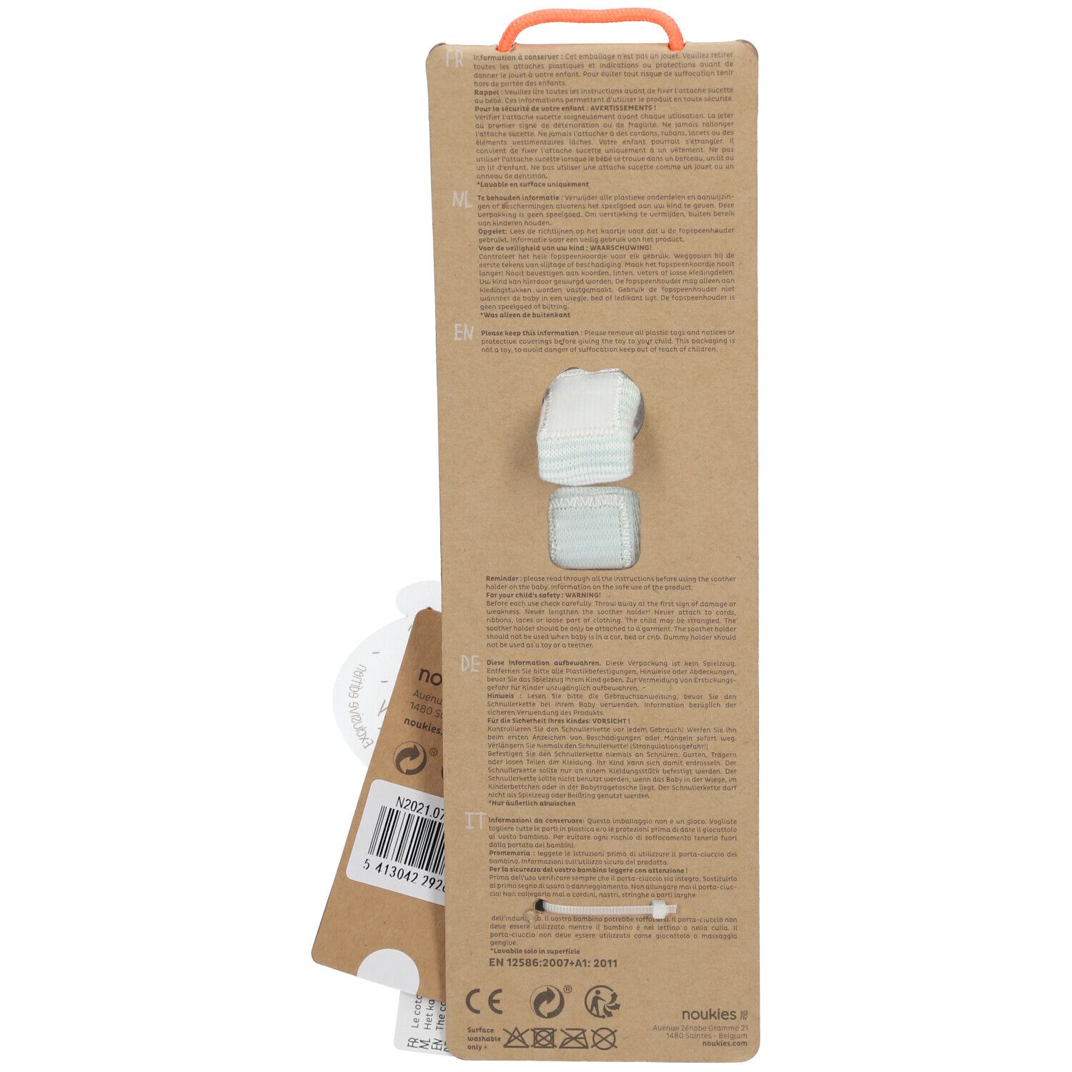 Emballage de la chaîne de sucette. Carton brun avec poignée orange. Deux tétines visibles. Texte multilingue.