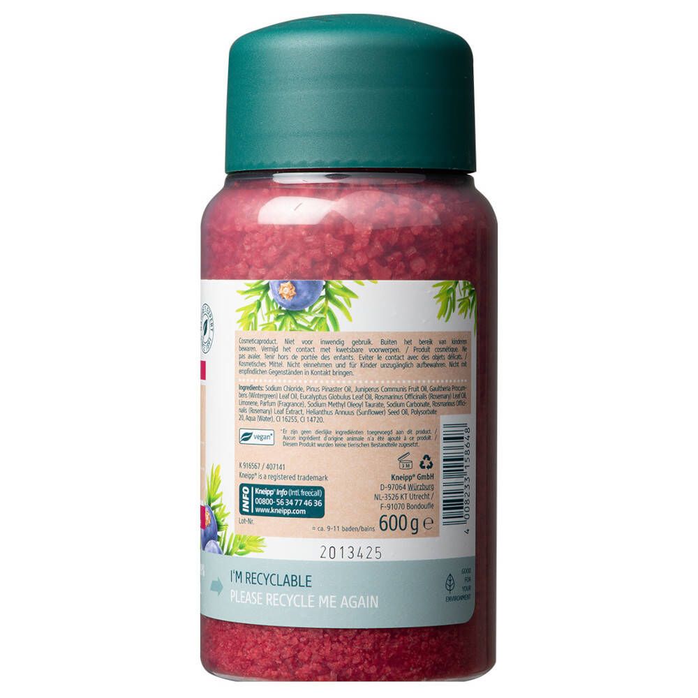 Achterkant van de fles met tekst. Bevat informatie over ingrediënten, gebruik en fabrikant. Met recyclingsymbolen.