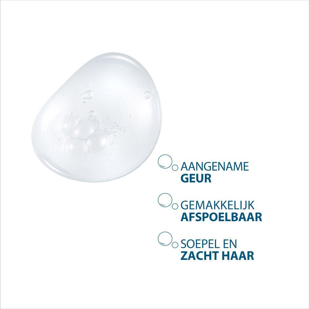 Close-up van een transparante vloeistof met bellen. Tekst: Aangename geur, gemakkelijk afspoelbaar, zacht haar.