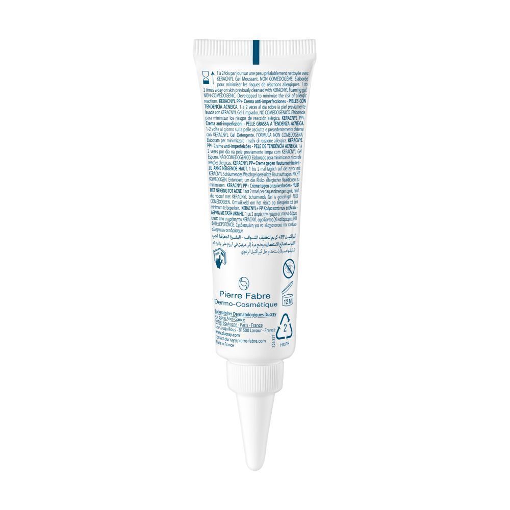 Dos du tube. Texte et logos. Informations sur le produit. Blanc et bleu.