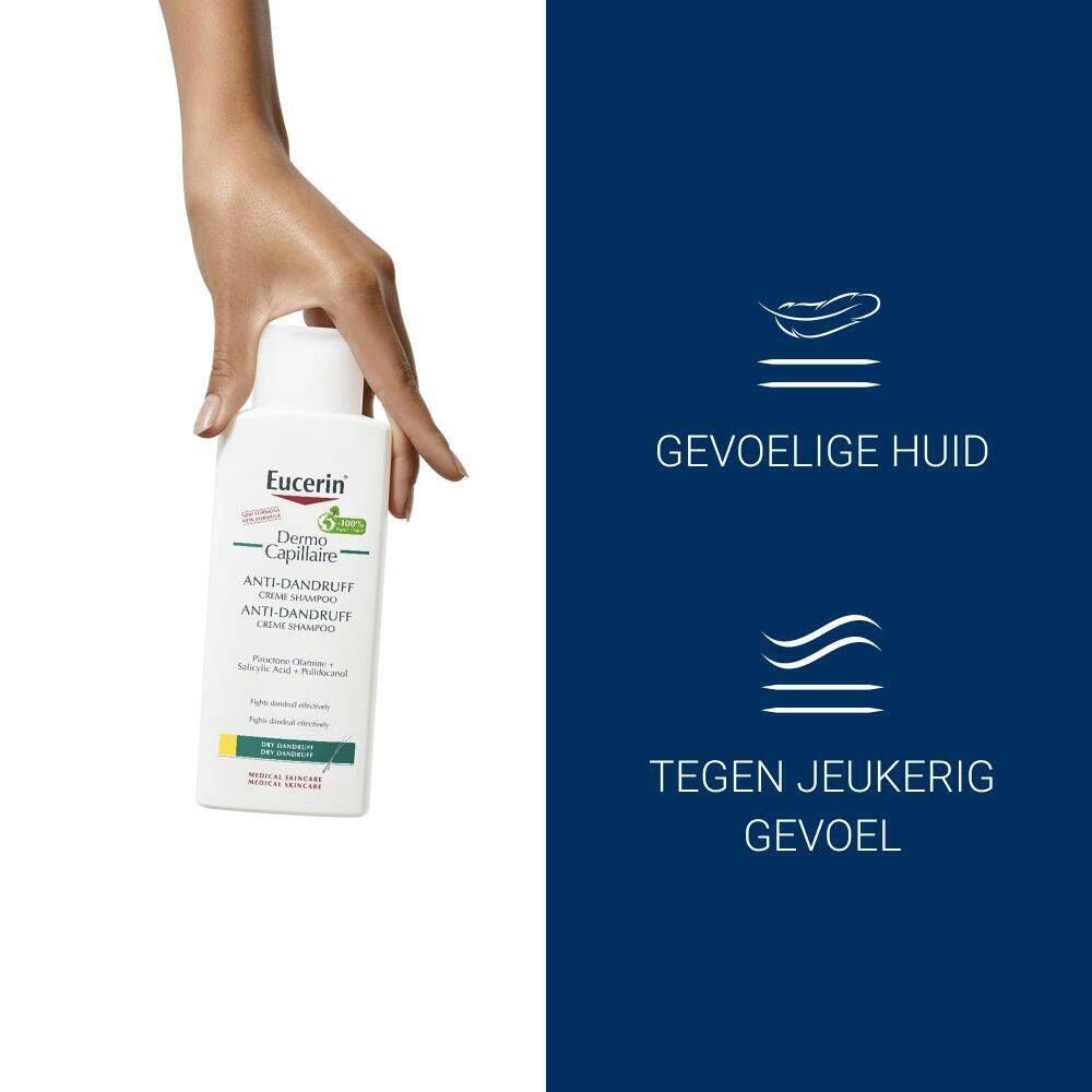 Hand houdt Eucerin shampoo vast. Tekst: Voor gevoelige huid, tegen jeuk.