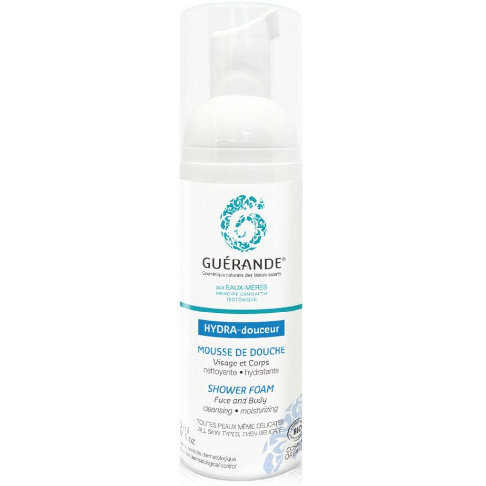 Weiße Flasche mit blauem Etikett. Text: GUÉRANDE, HYDRA-douceur, MOUSSE DE DOUCHE, SHOWER FOAM. Bio-Zertifizierung.