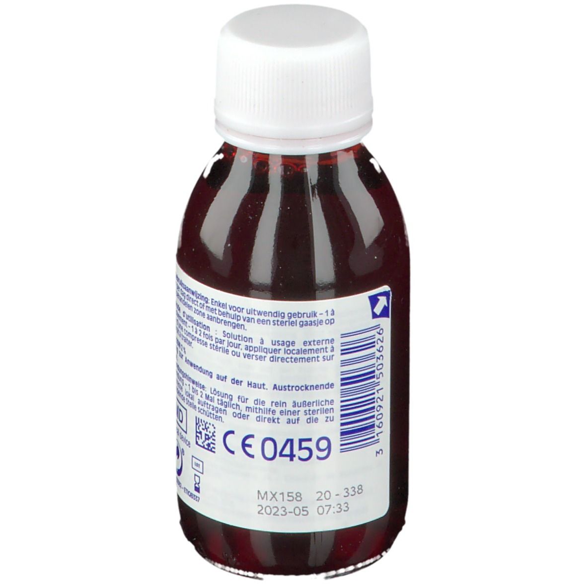 Flacon de liquide rouge. Bouchon blanc. Dos avec texte et marquage CE. Indication de date.