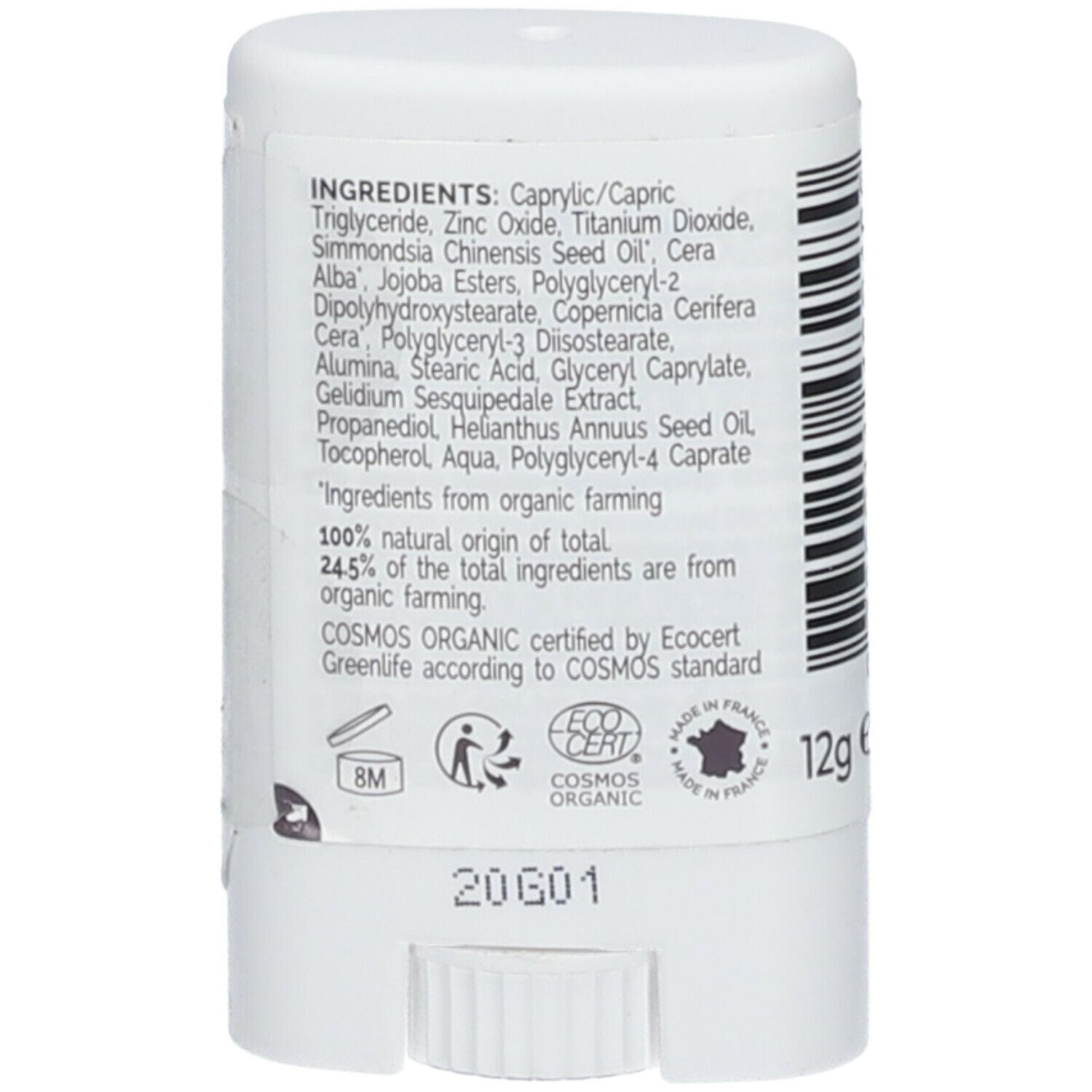 Gros plan sur les ingrédients du stick solaire blanc. Contient des informations sur les ingrédients et les certifications.