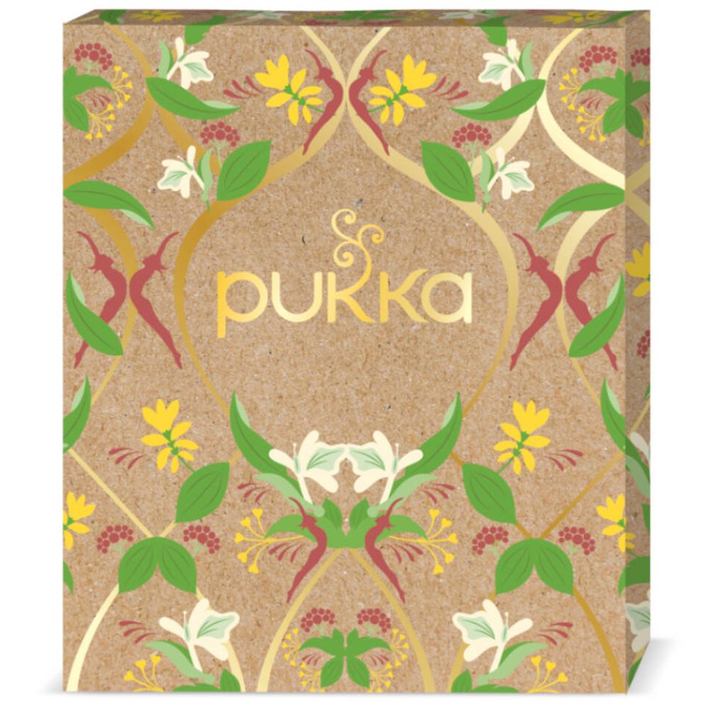 Kartonnen doos met bloemmotief en goudkleurig Pukka-logo.