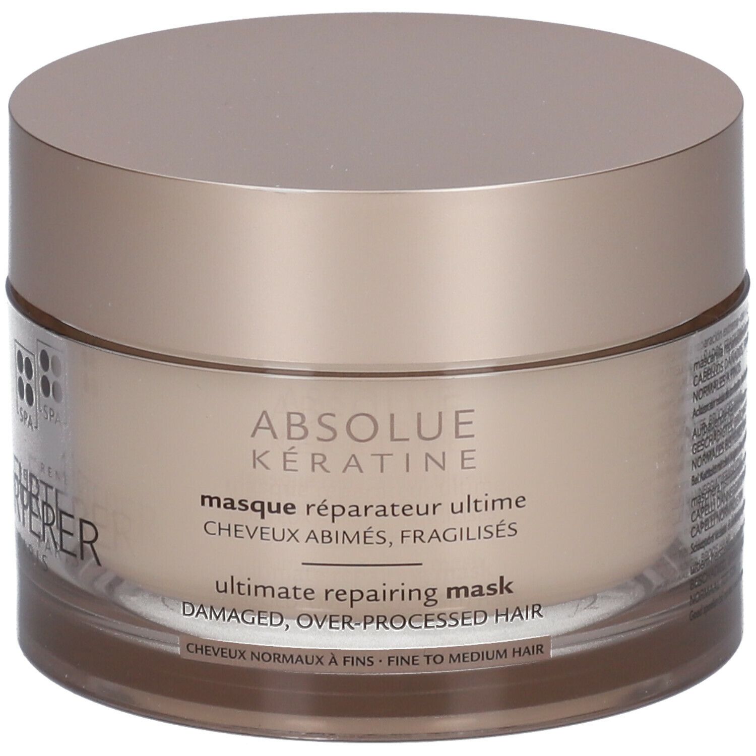 Beige pot met deksel. Opschrift: ABSOLUE KERATINE, masque réparateur ultime, ultimate repairing mask.