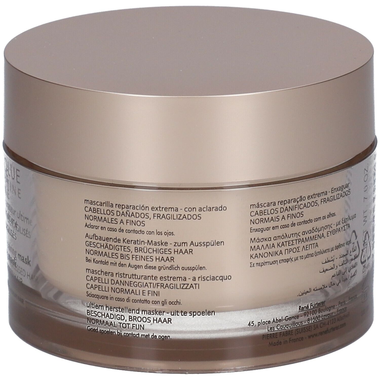 Achterkant van de beige pot met deksel. Tekst in meerdere talen. Opschrift: Herstellend keratine masker.