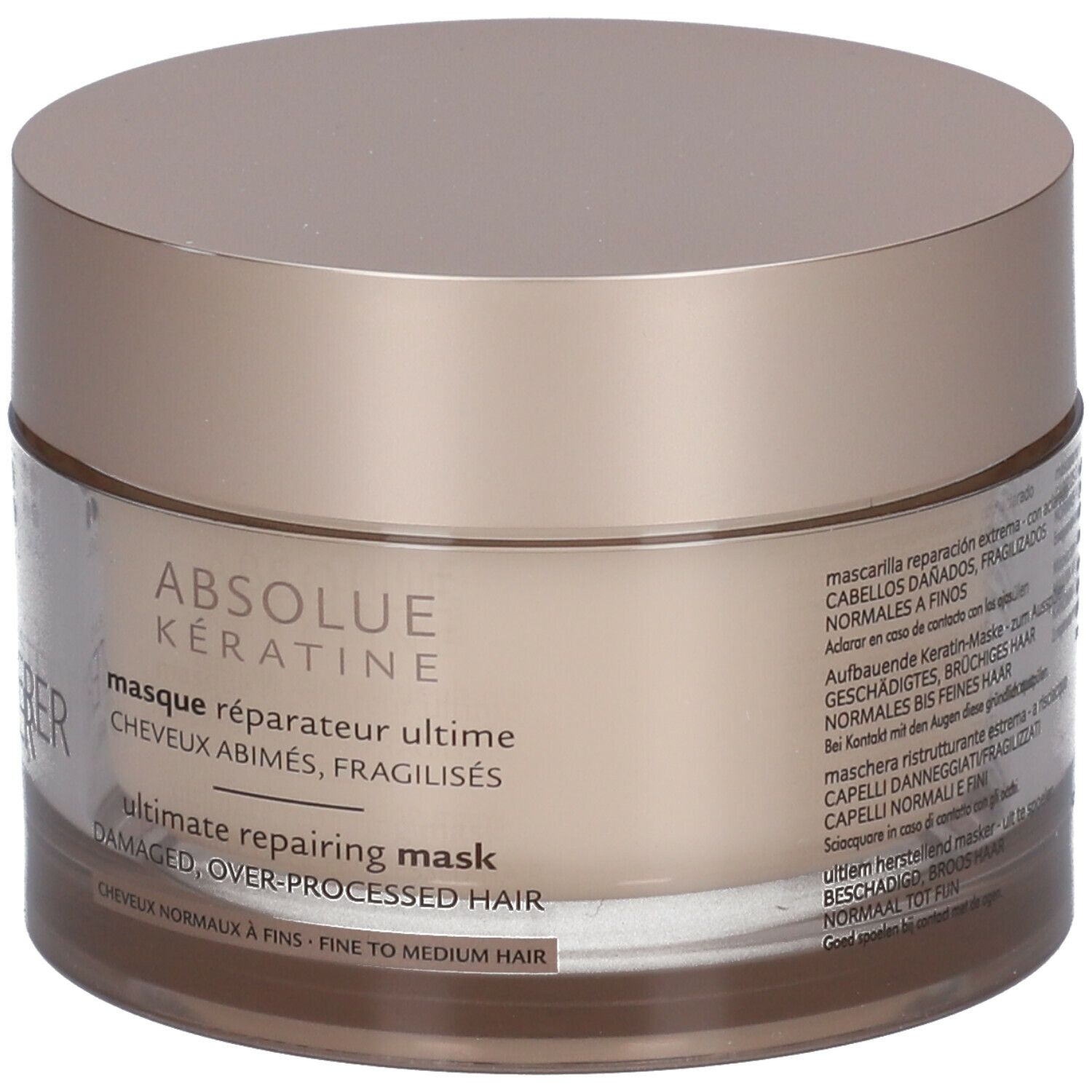 Beige pot met deksel. Opschrift: ABSOLUE KERATINE, masque réparateur ultime, ultimate repairing mask.