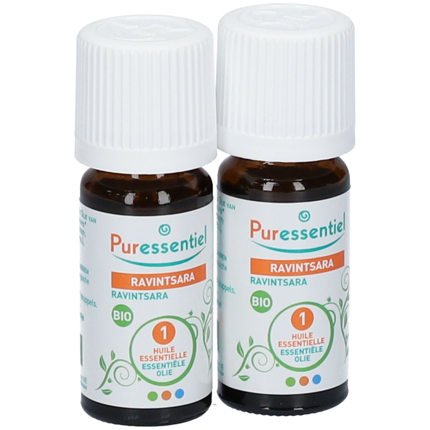 Twee bruine glazen flessen met witte doppen. Etiketten met productinformatie. Puressentiel Ravintsara.