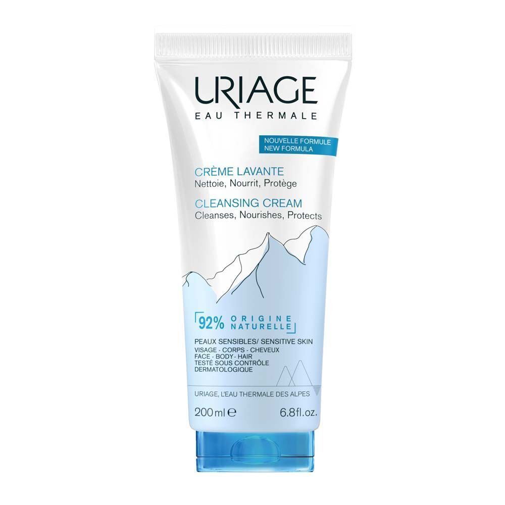 Witte en blauwe tube met URIAGE-logo. Tekst: Crème Lavante, Cleansing Cream. 200ml, 6.8 fl.oz. 92% natuurlijke ingrediënten.