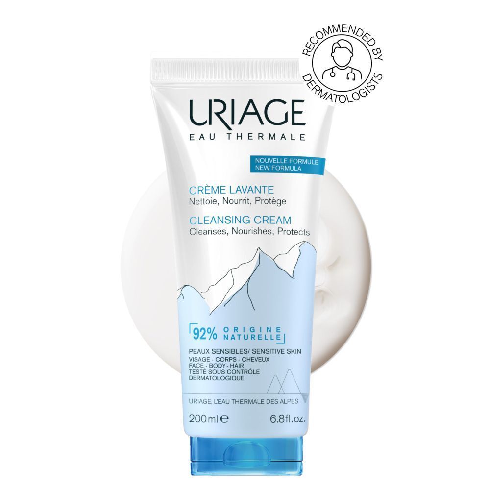 Witte en blauwe tube met URIAGE-logo. Tekst: Crème Lavante, Cleansing Cream. 200ml, 6.8 fl.oz. 92% natuurlijke ingrediënten.