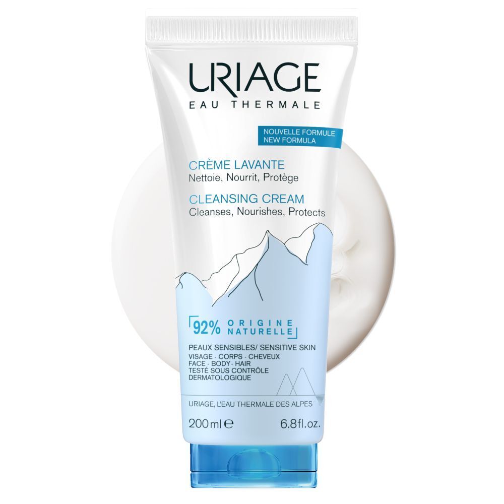 Witte en blauwe tube met URIAGE-logo. Tekst: Crème Lavante, Cleansing Cream. 200ml, 6.8 fl.oz. 92% natuurlijke ingrediënten.