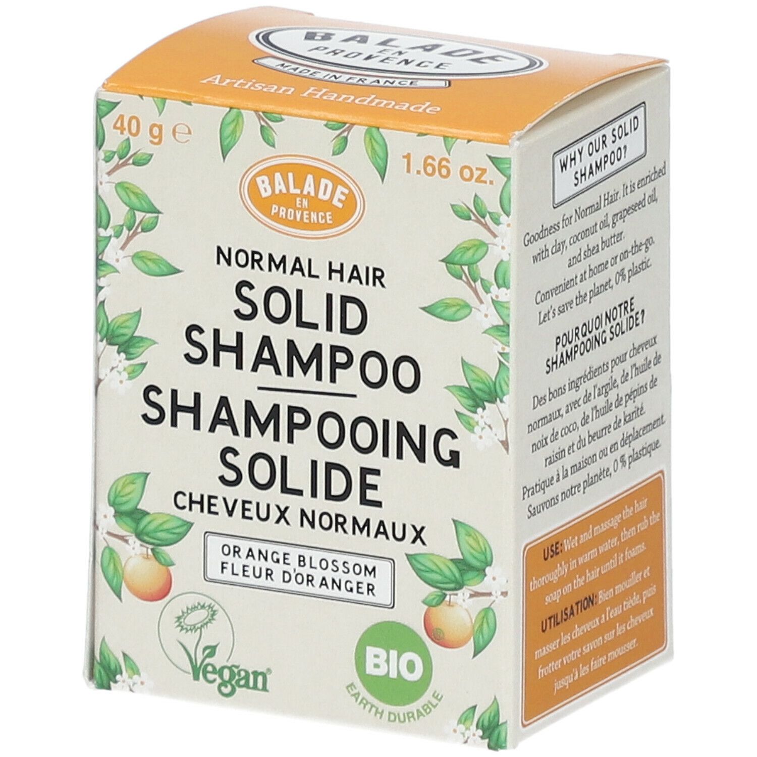 Vaste shampoo verpakking. Oranje doos met productnaam en logo. Vegan en Bio certificering.