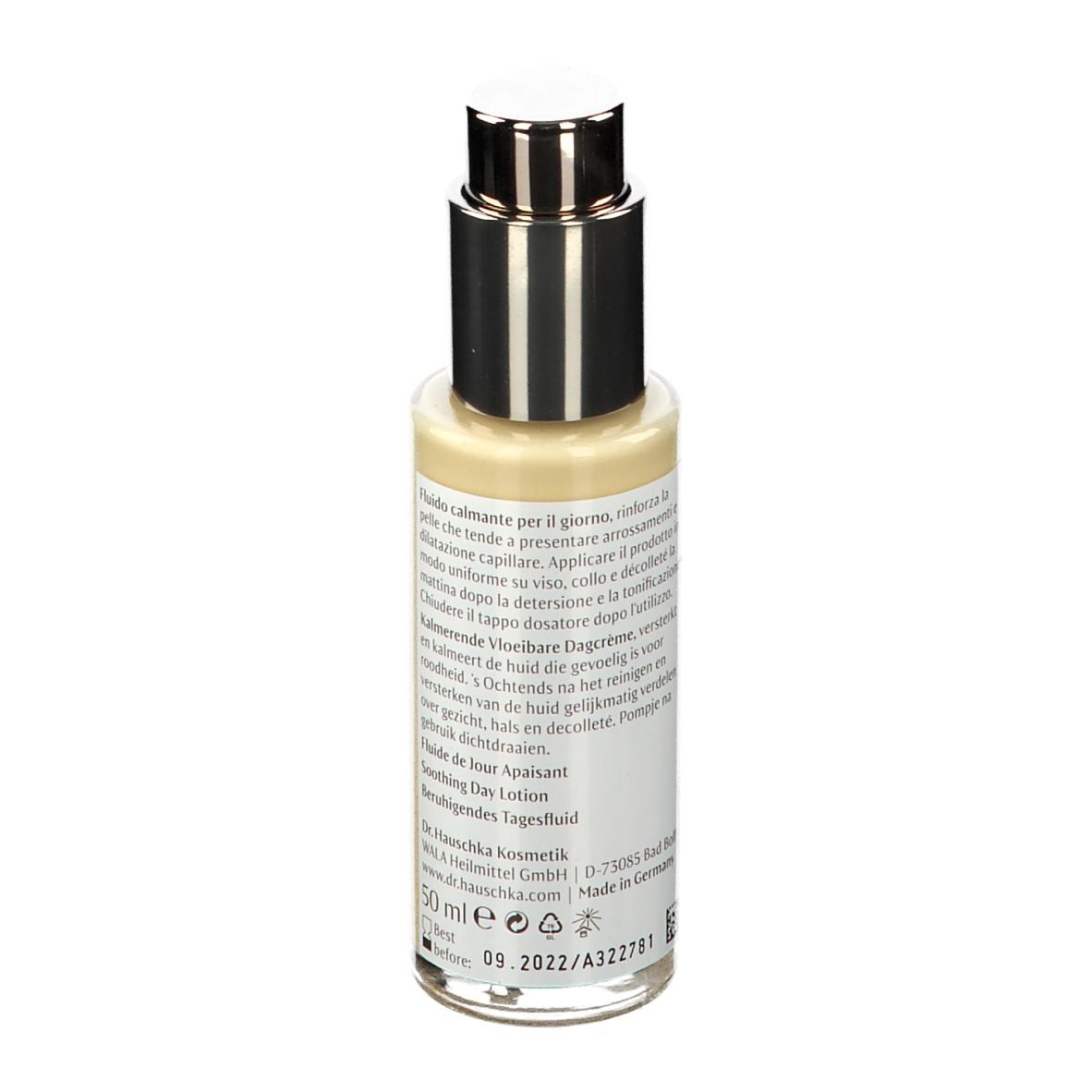 Achterkant van beige fles met zilveren pomp. Tekst op etiket. Oranje streep. 50 ml.