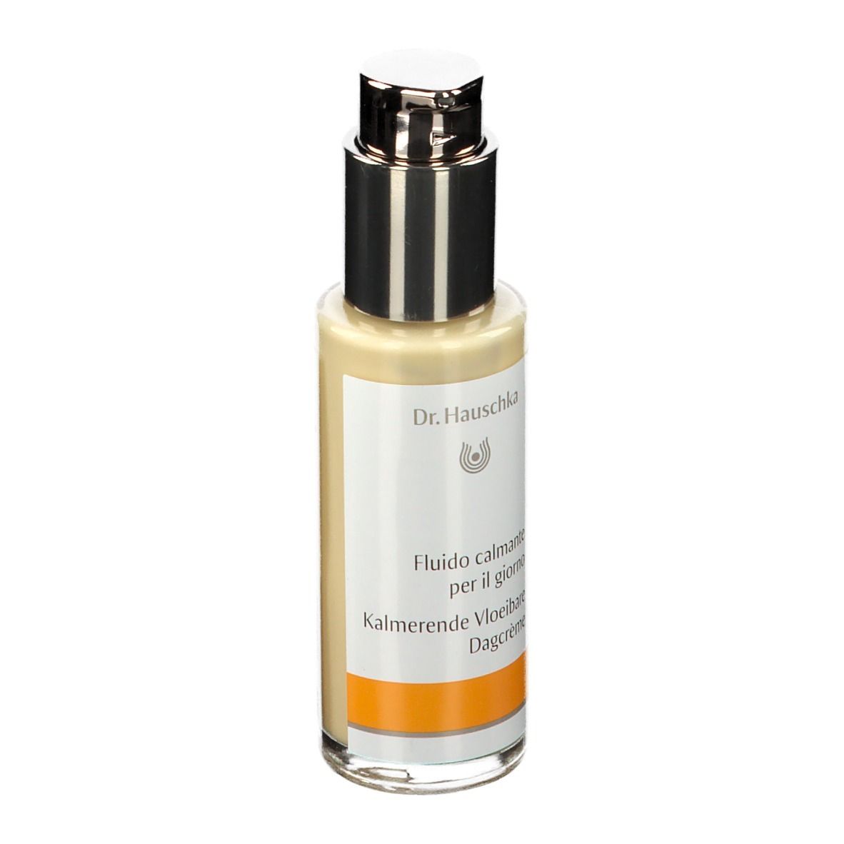 Beige fles met zilveren pomp. Etiket met tekst en oranje streep. Dr. Hauschka logo.