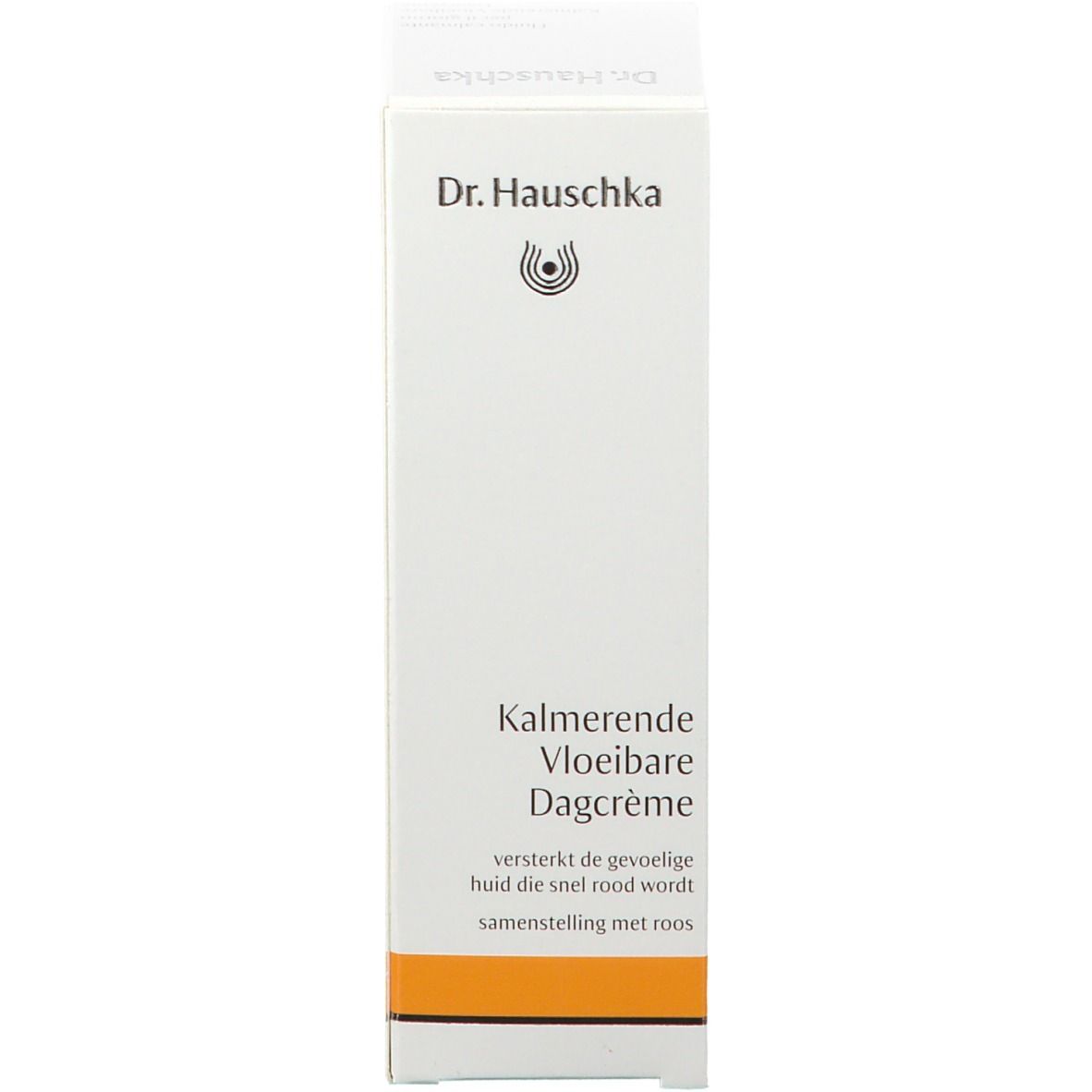 Witte doos met tekst en logo. Oranje streep. Dr. Hauschka logo. Productnaam.
