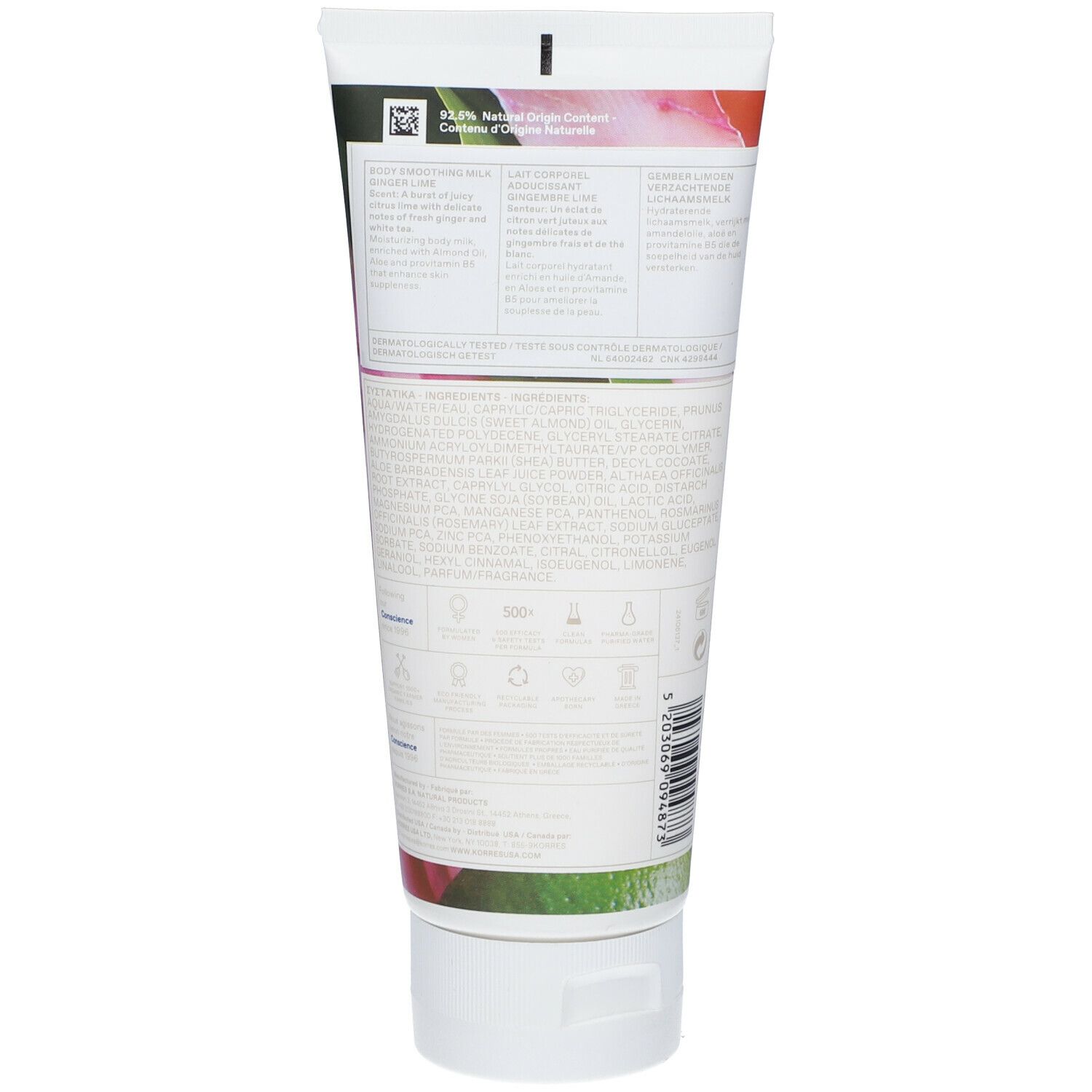 Achterkant van de body milk tube. Tekst en ingrediënten in meerdere talen. Witte tube met groene en roze elementen.